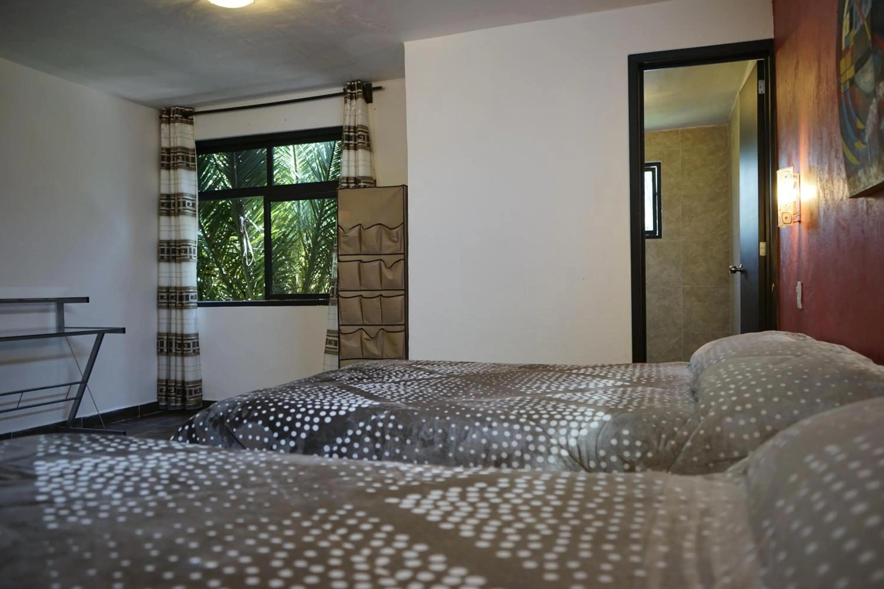 Bed in Telpochcalli Hotel & Temazcal