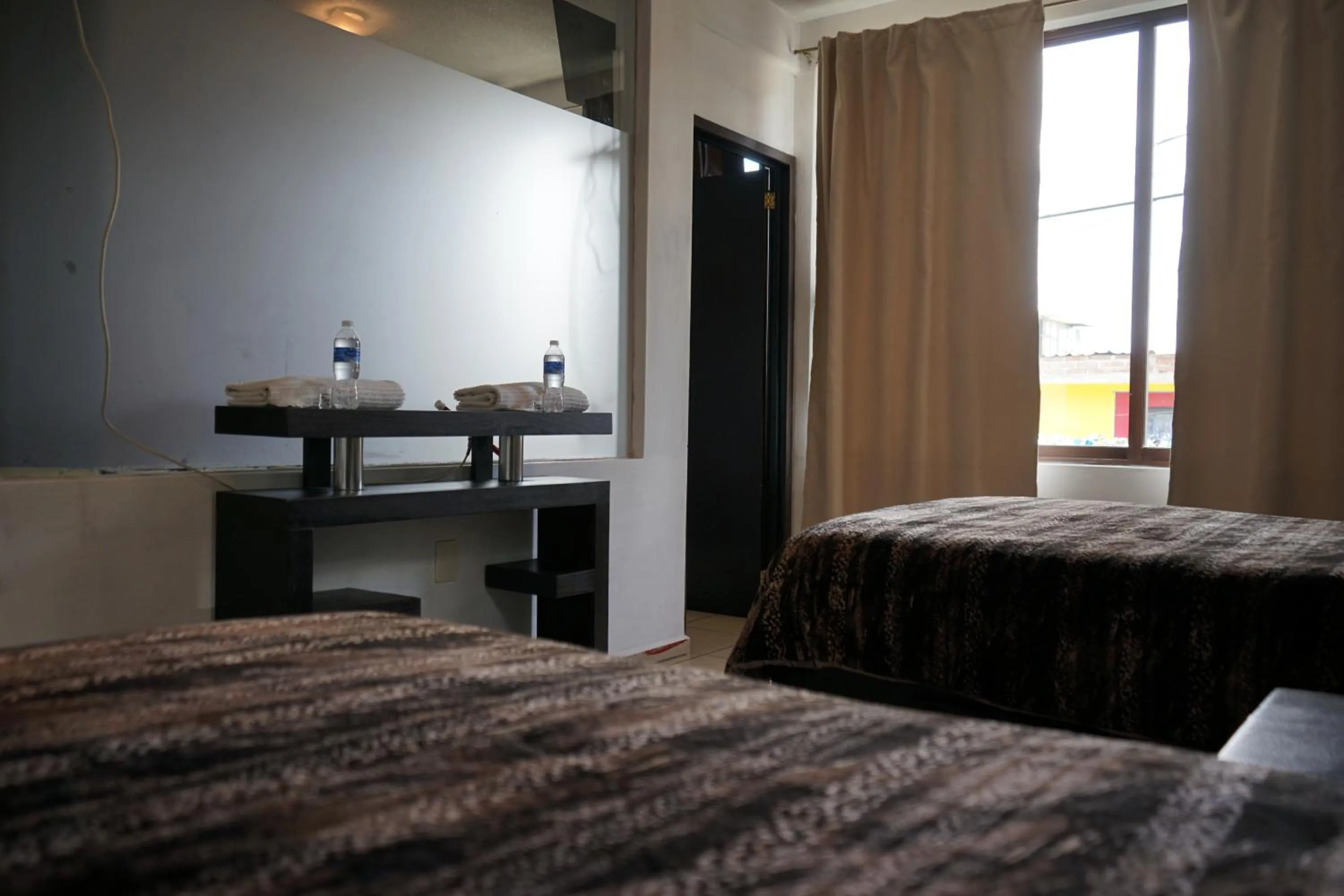 Bed in Telpochcalli Hotel & Temazcal