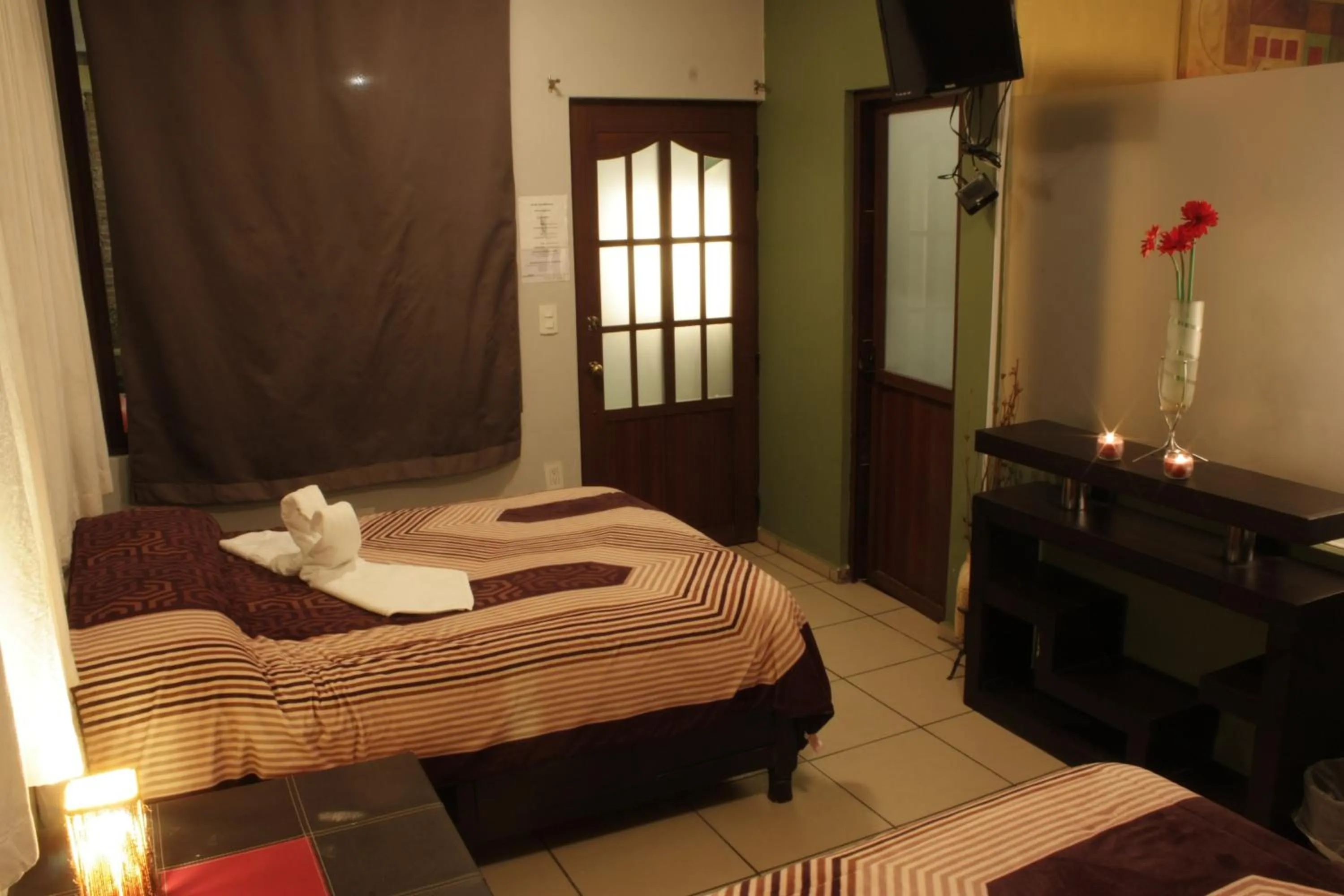 Bed in Telpochcalli Hotel & Temazcal