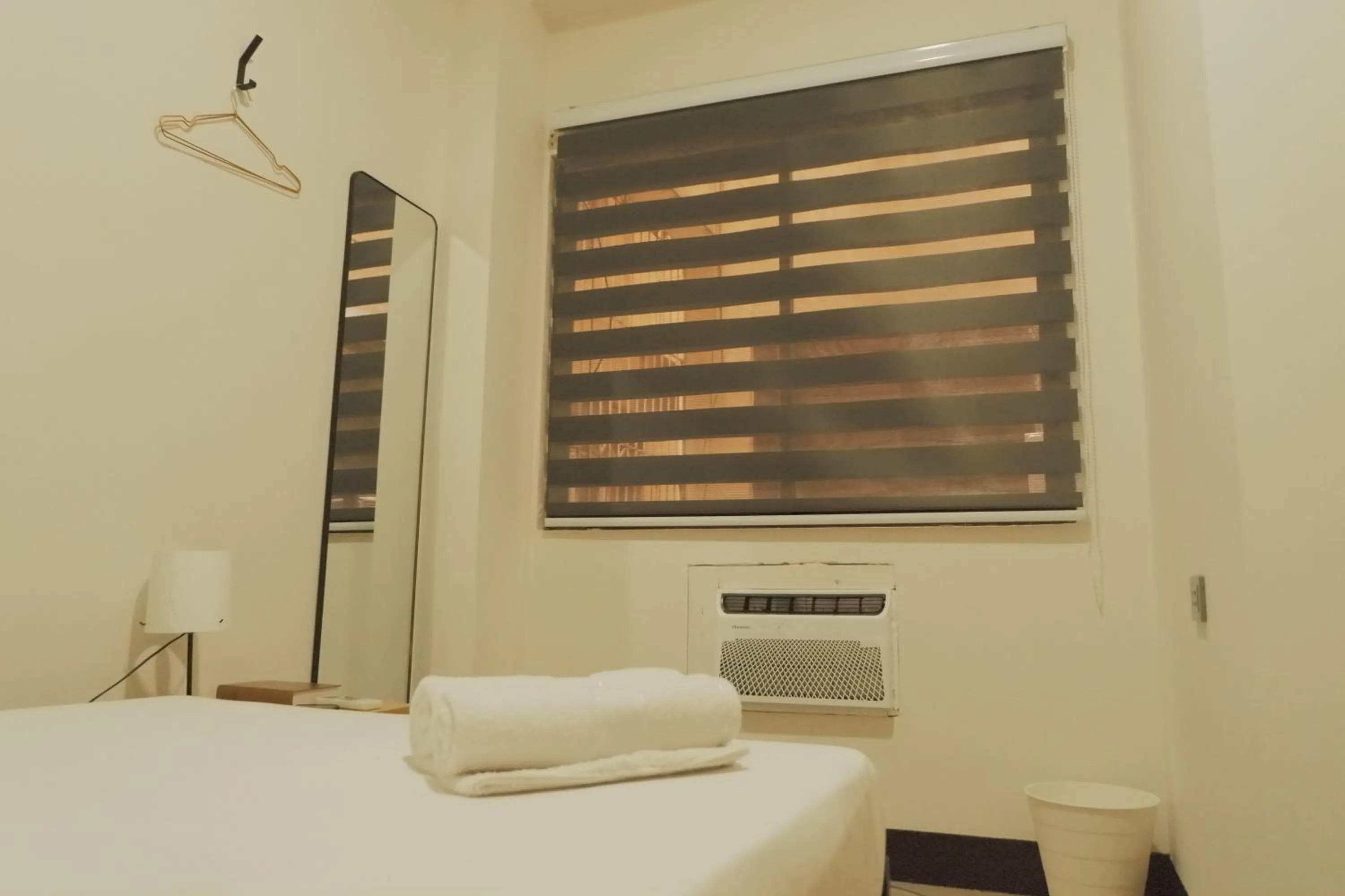 Bed in Brightwood Hotel & Residences