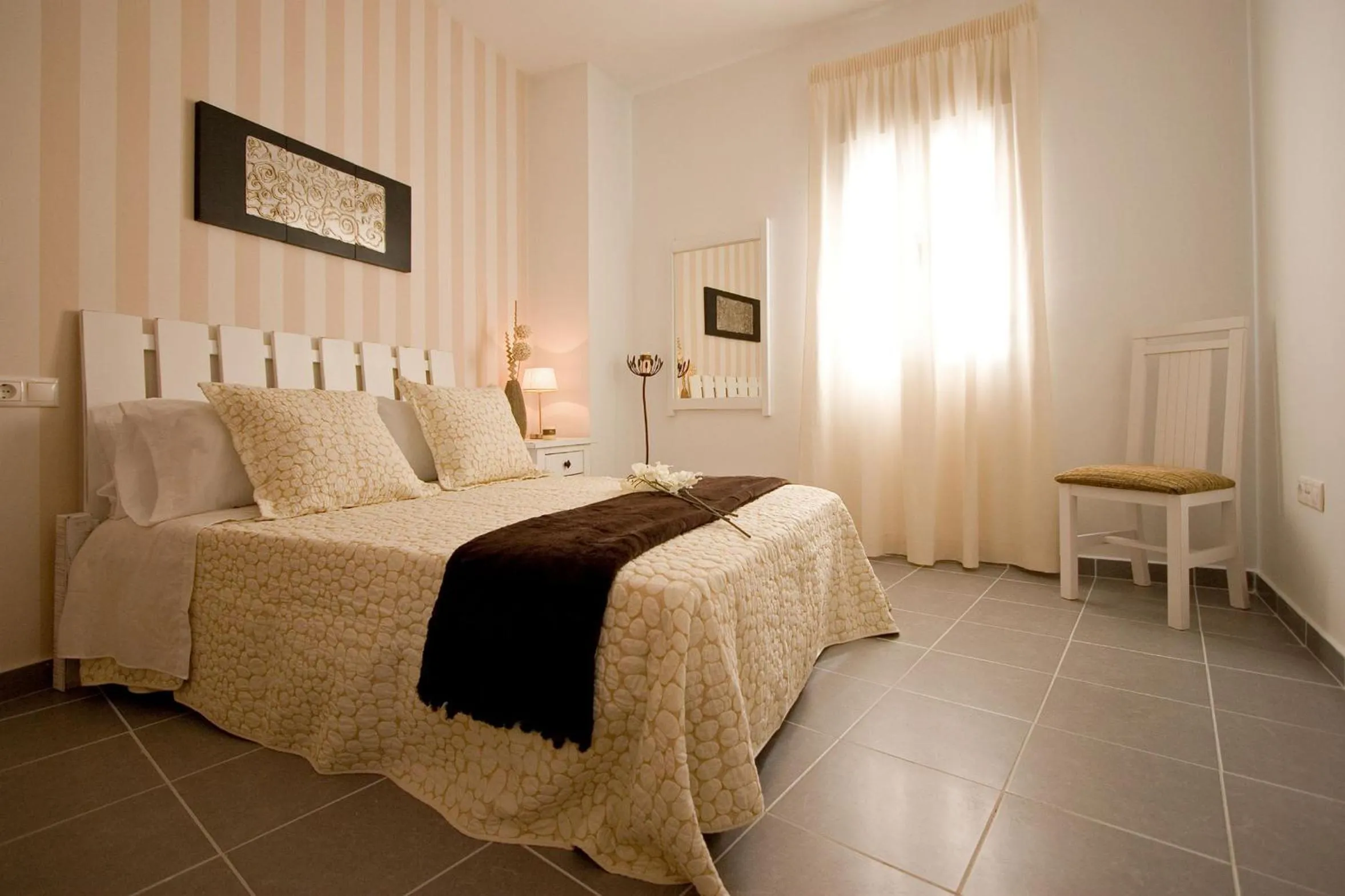 Photo of the whole room, Bed in BeSlow Ayamonte