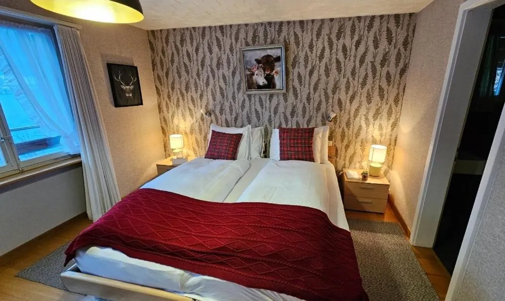 Bedroom, Bed in Alpina Boutique Hotel Interlaken - Ringgenberg - Adults only !