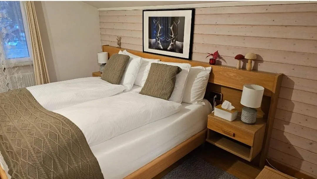 Bed in Alpina Boutique Hotel Interlaken - Ringgenberg - Adults only !