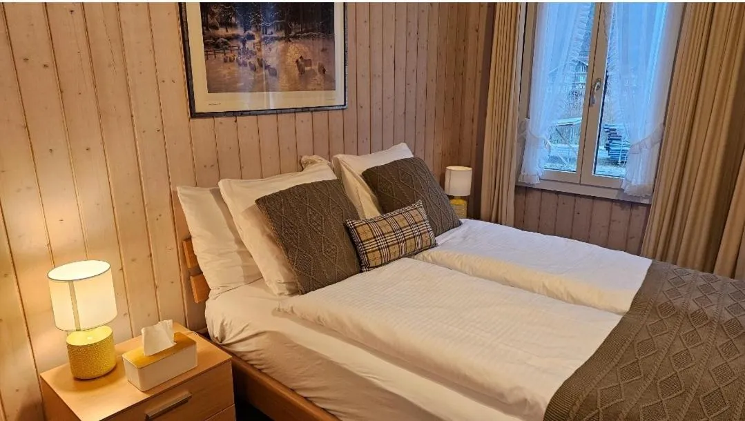 Bed in Alpina Boutique Hotel Interlaken - Ringgenberg - Adults only !