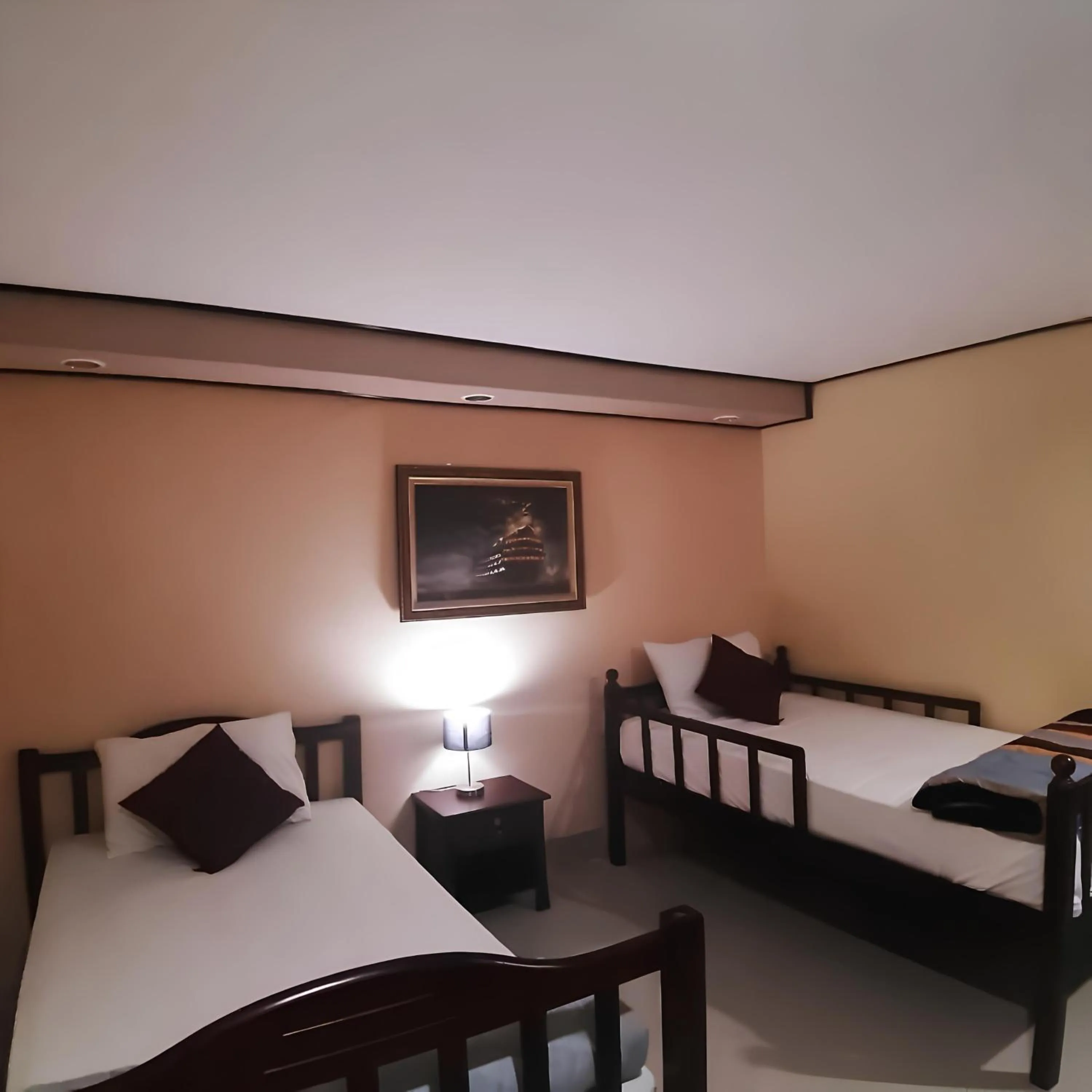 Bed in The Windsor Boutique Resort