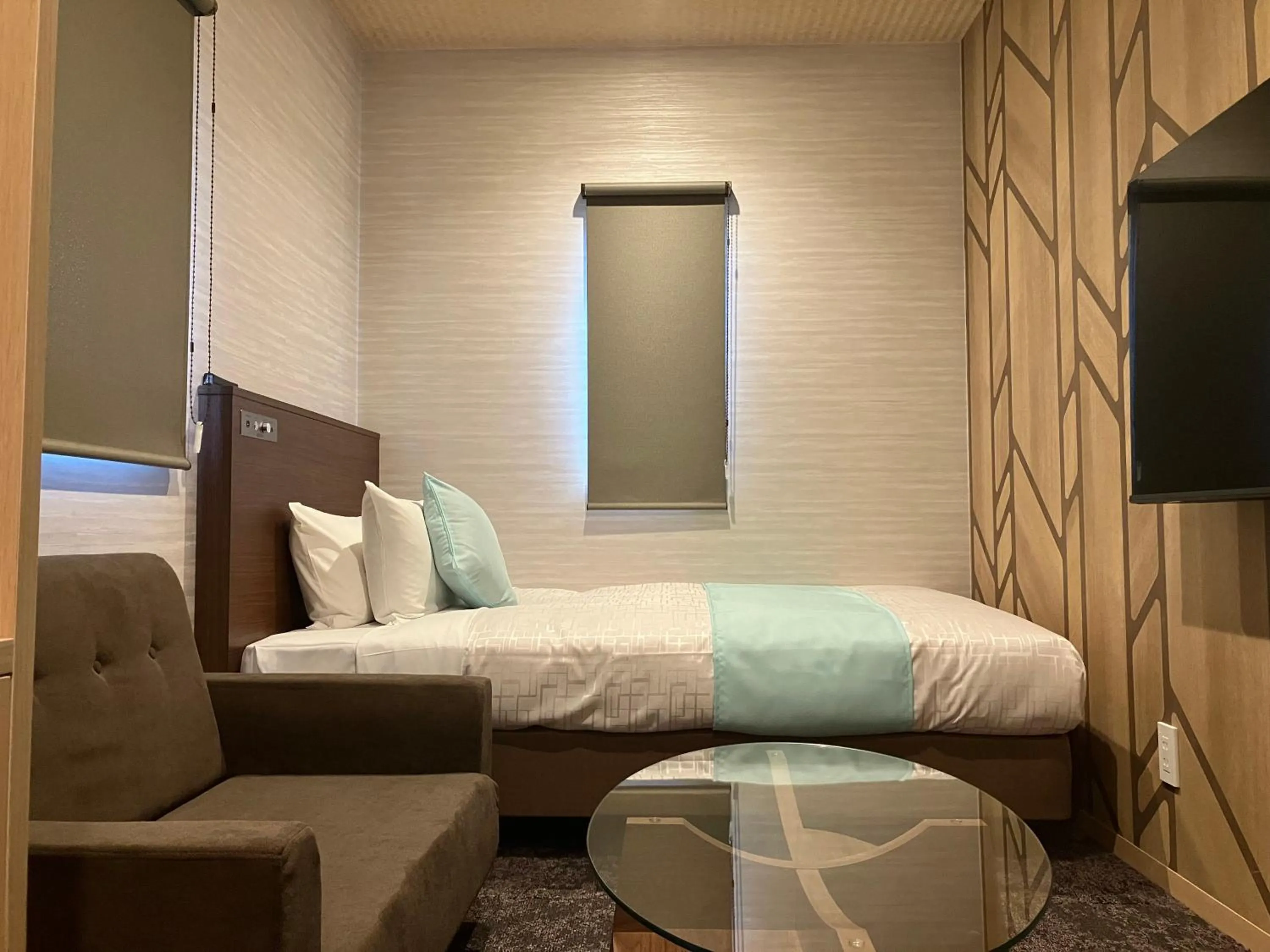 Bed in Hotel LiVEMAX Tendo