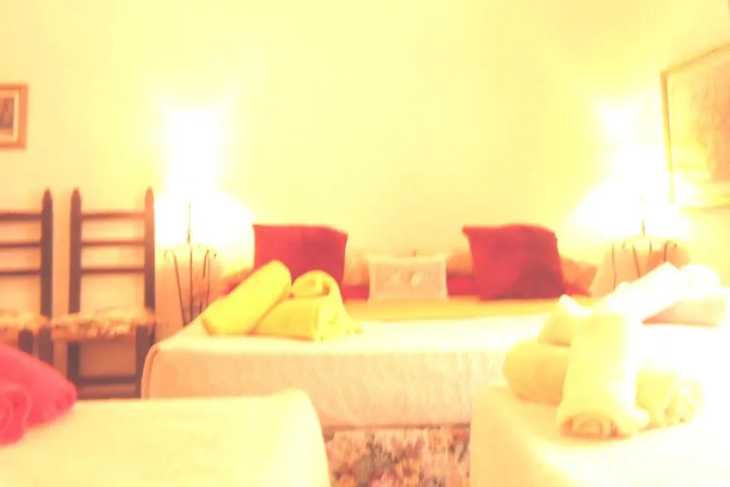 Bed in ITALIA GUESTHOUSe