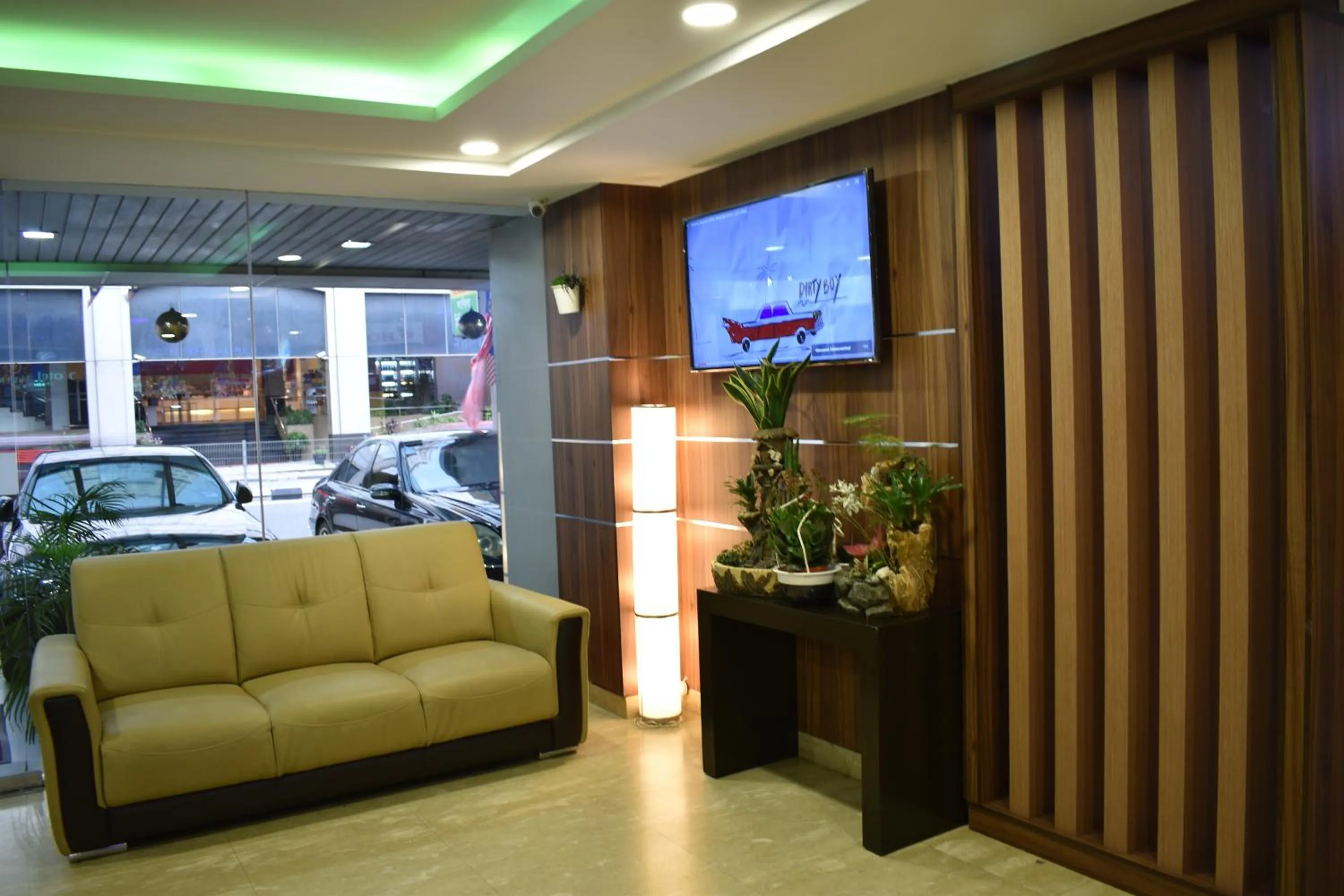 Communal lounge/ TV room in Xpeed Holiday Hotel