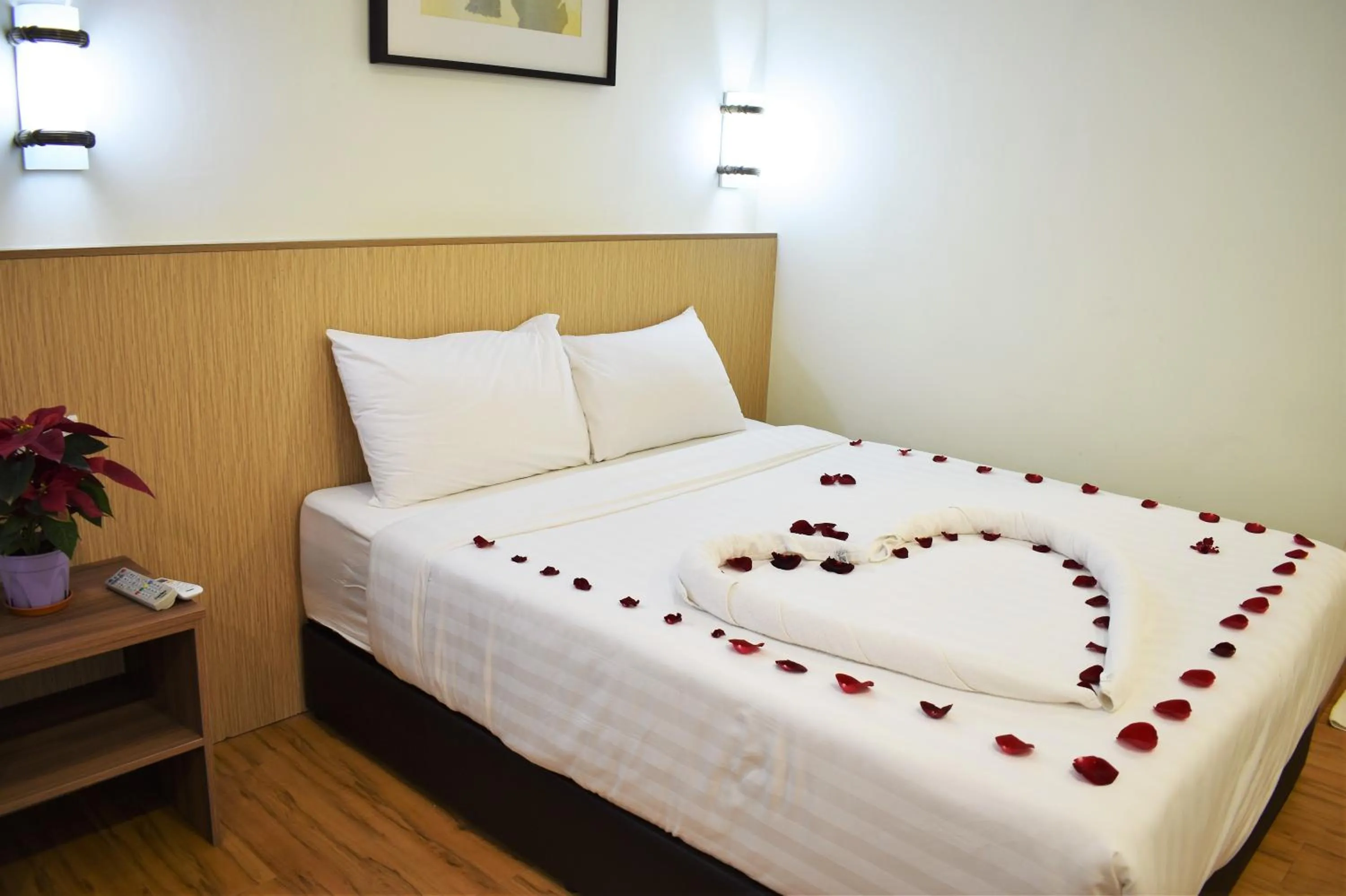 Bed in Xpeed Holiday Hotel