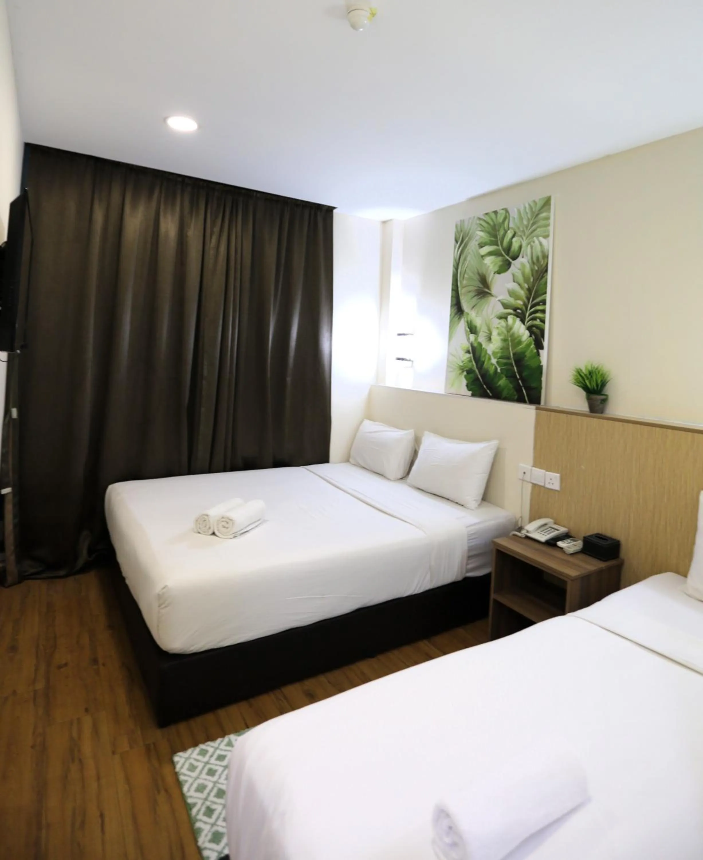 Bed in Xpeed Holiday Hotel