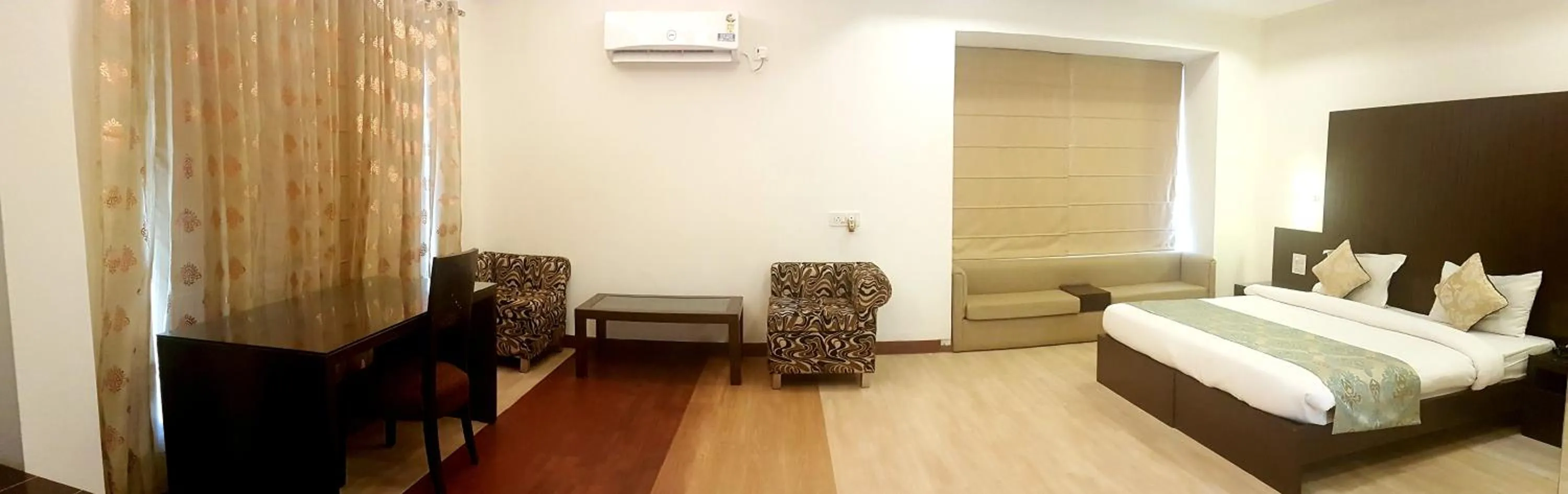 Photo of the whole room, Bed in Hotel Haris MG Road Gurugram