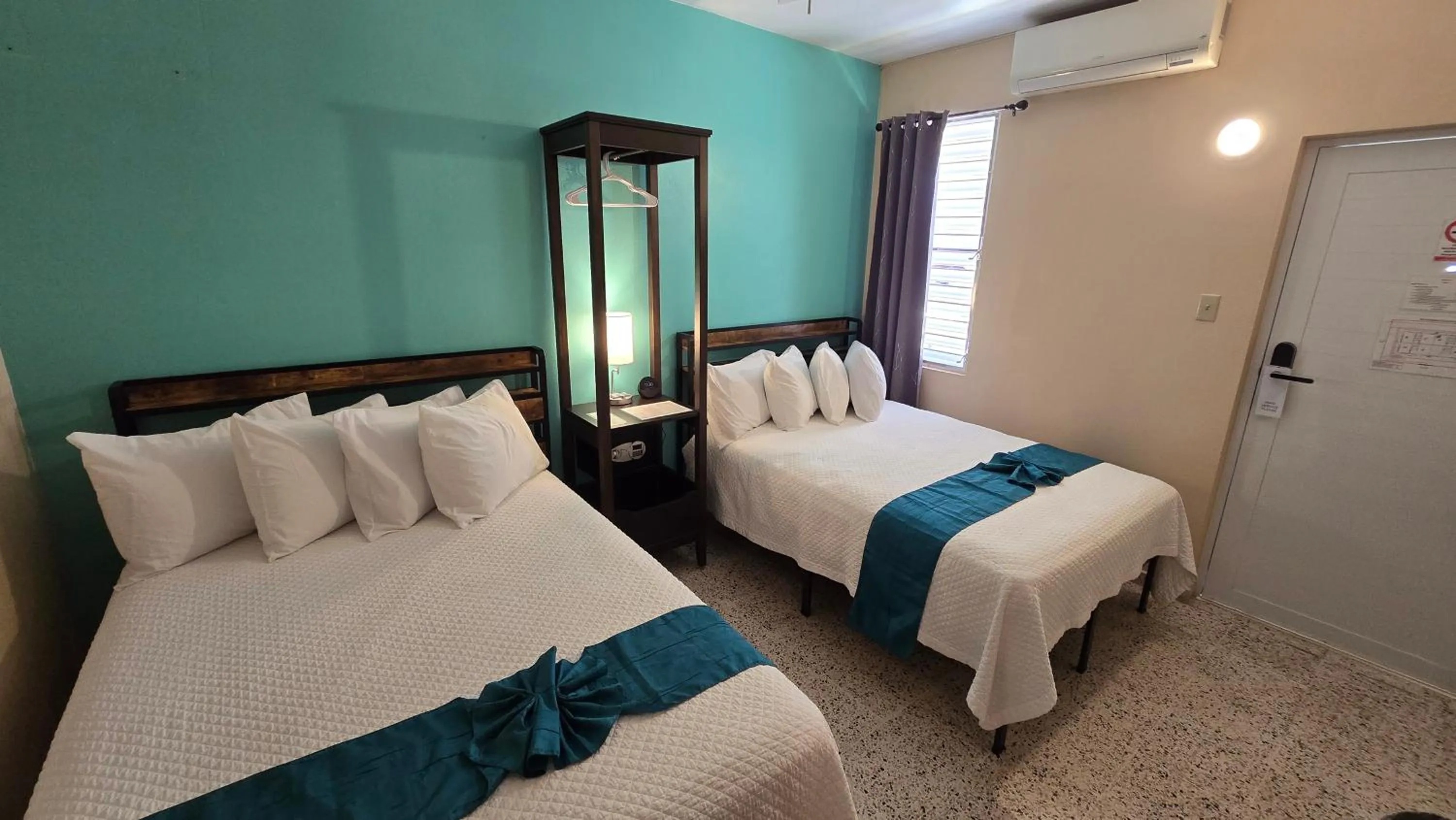 Bed in I Love Combate Rooms & Suites