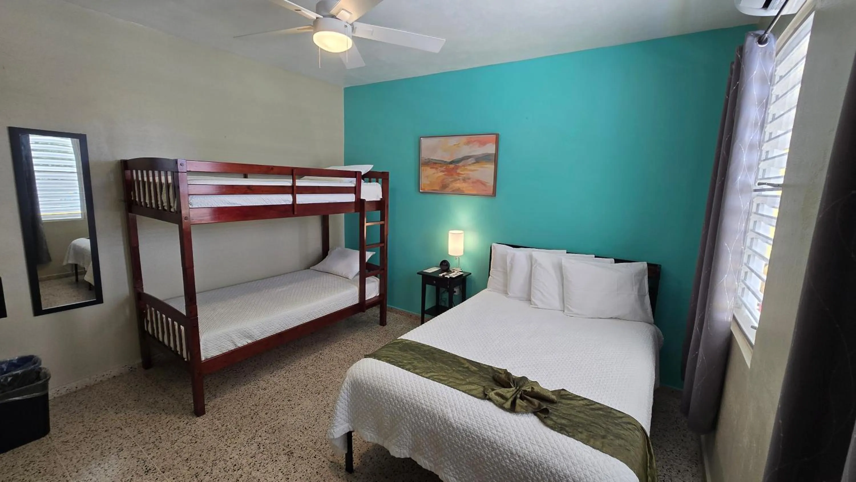 Bed in I Love Combate Rooms & Suites