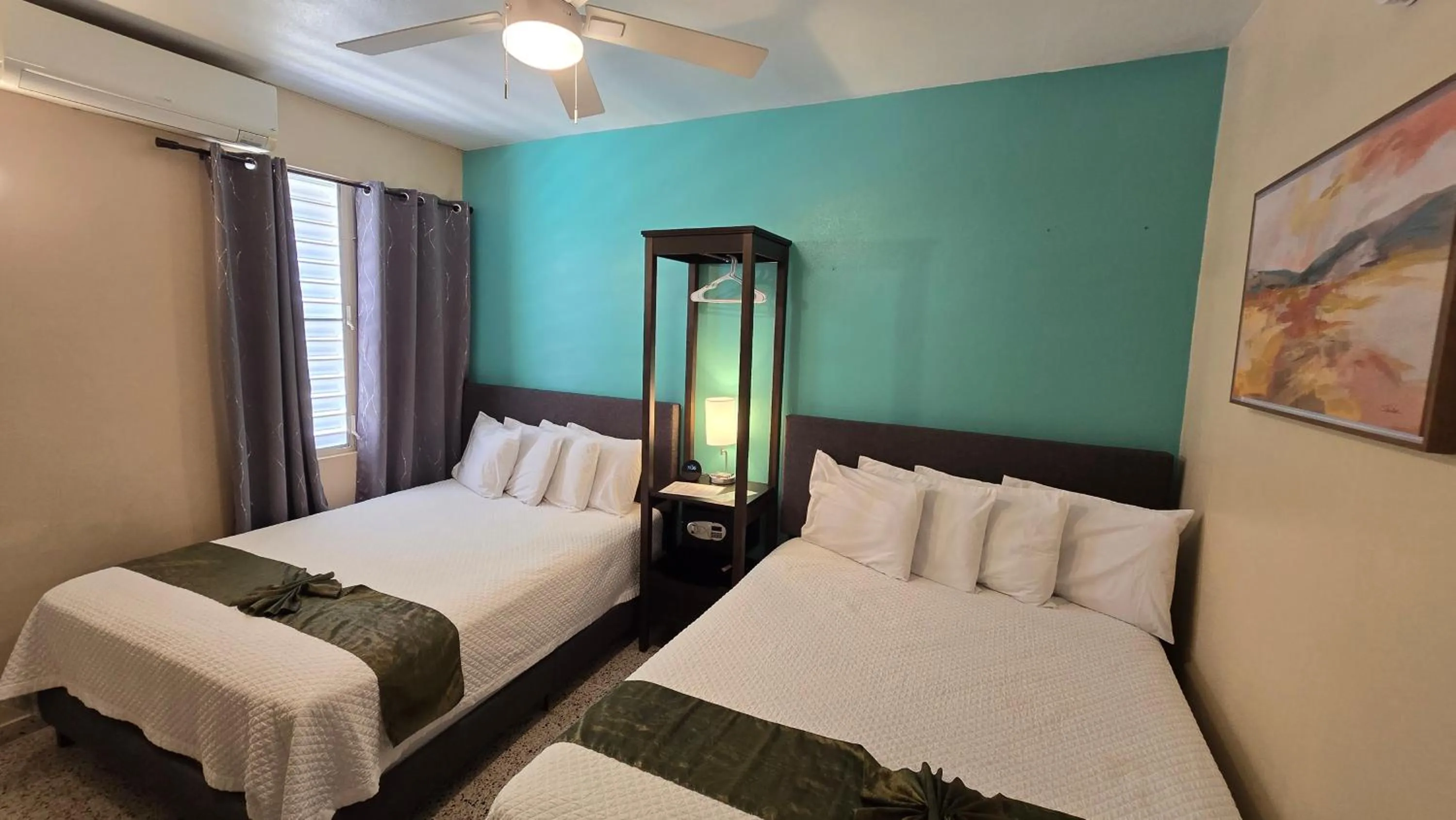 Bed in I Love Combate Rooms & Suites