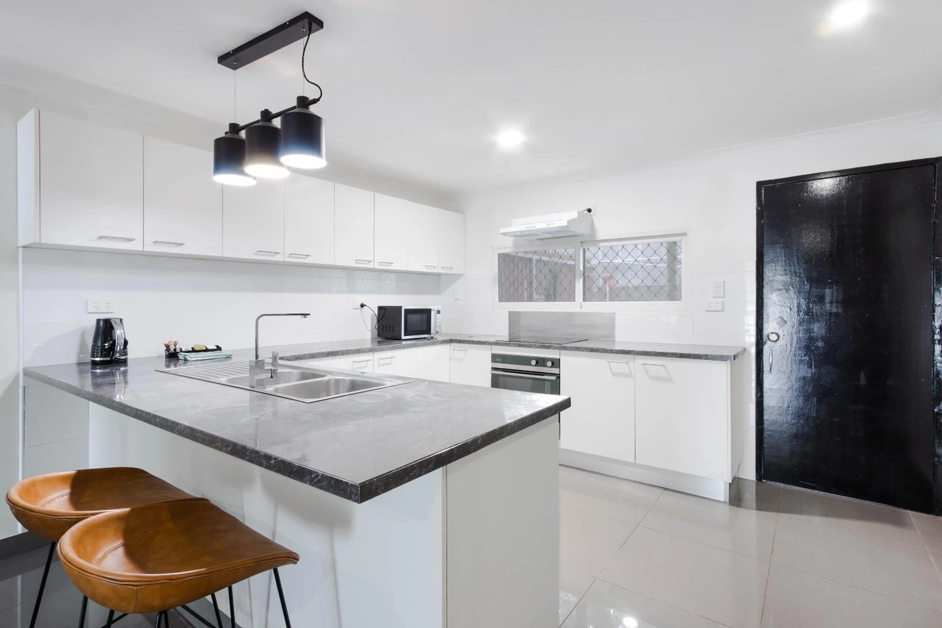 Kitchen or kitchenette in Citi Serviced Apartments - Gaba Place