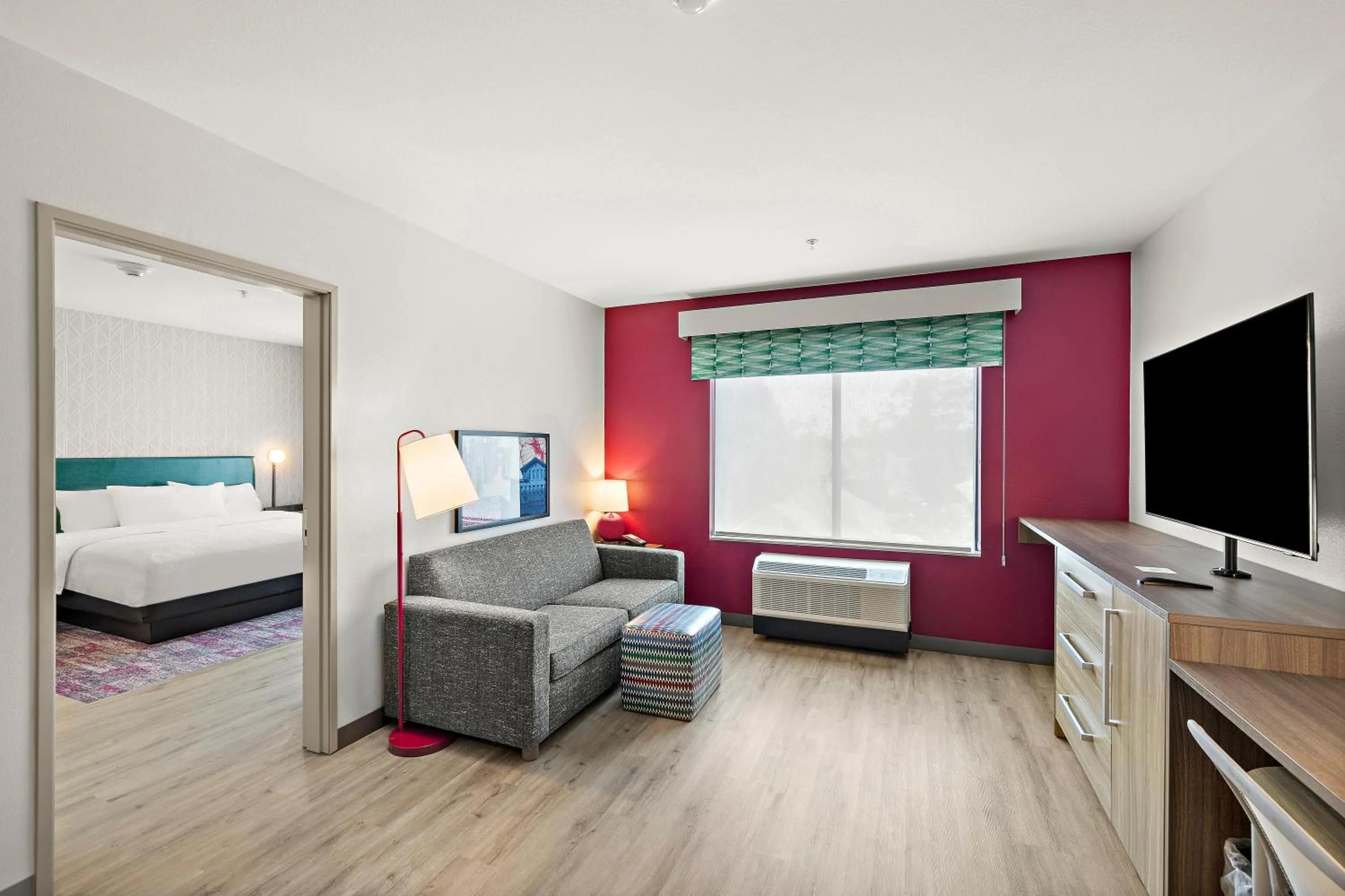 Living room, Bed in Home2 Suites By Hilton Riverside Downtown