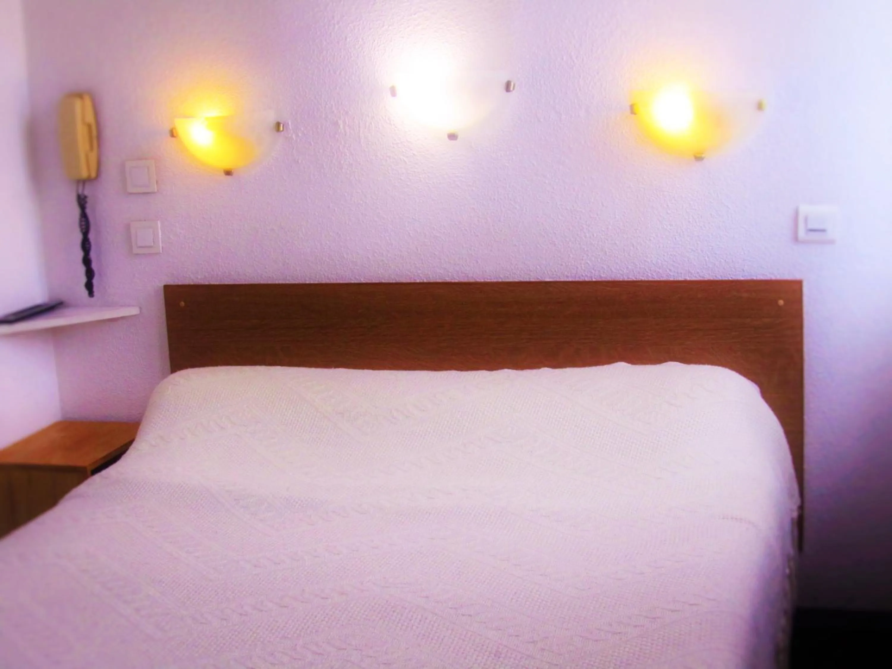 Bed in Hôtel Duchesse Anne