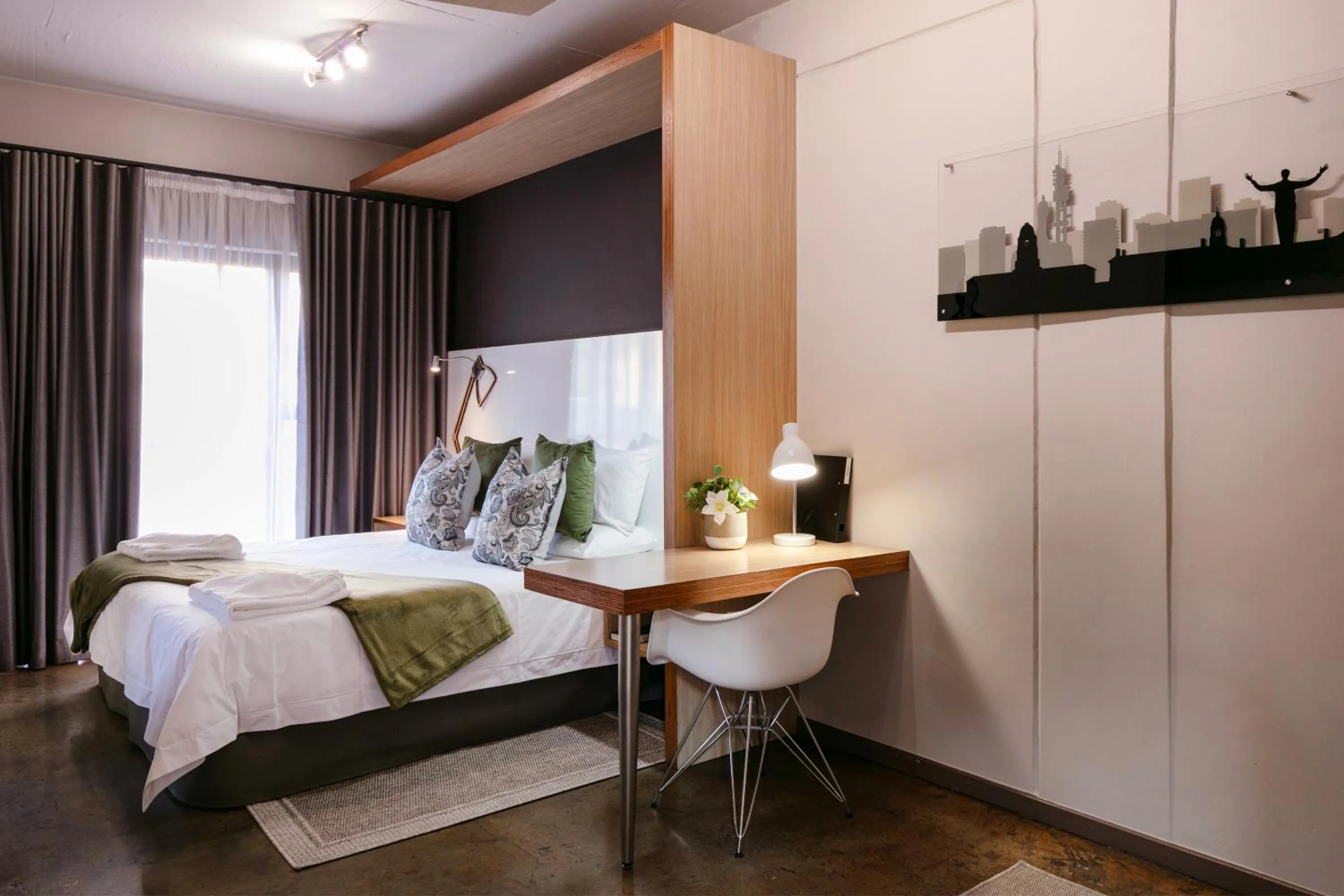 Bed in Akanani Apartments