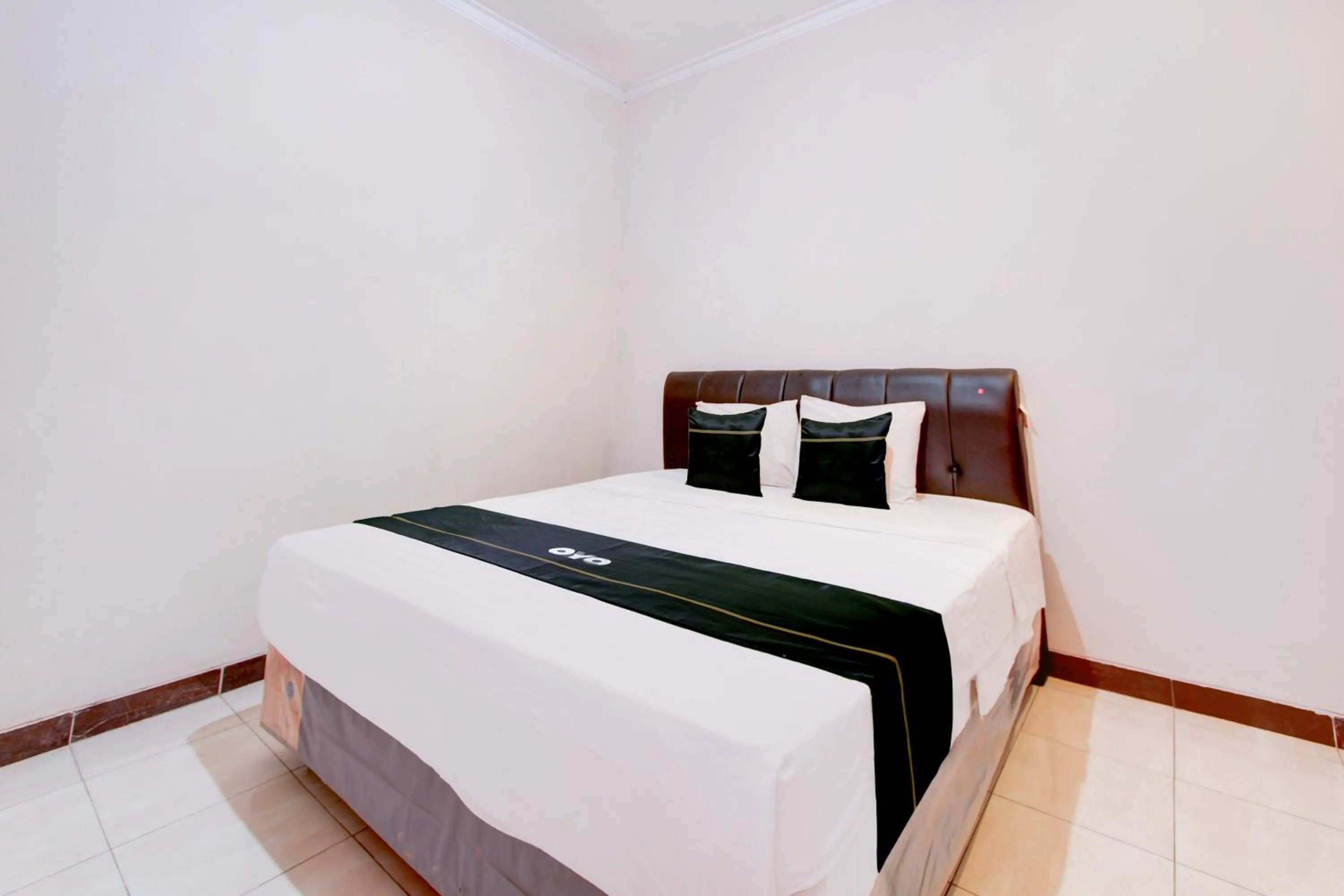 Bed in SPOT ON Podomoro Homestay