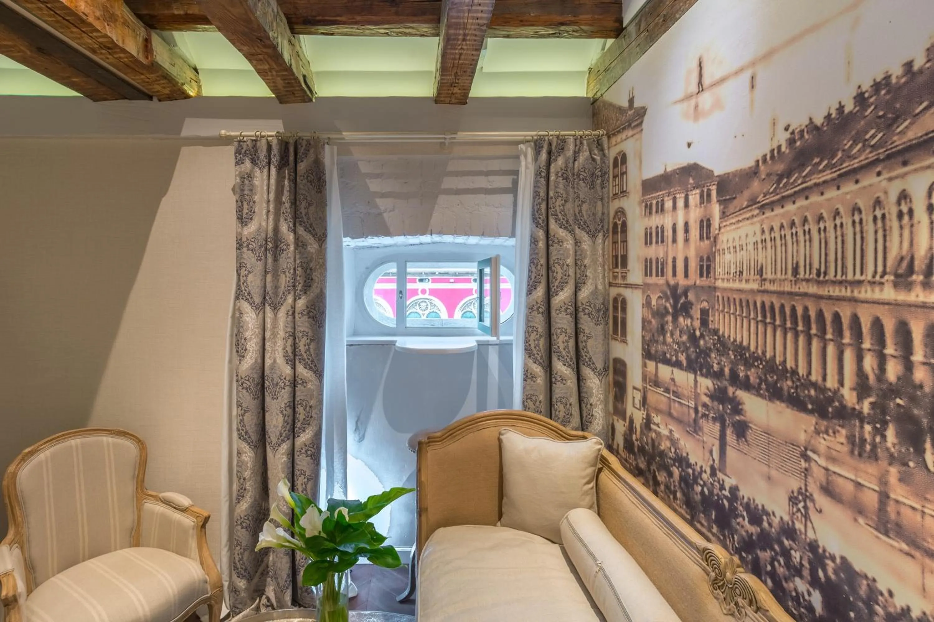 Seating area in Procurator 7 Luxury Rooms