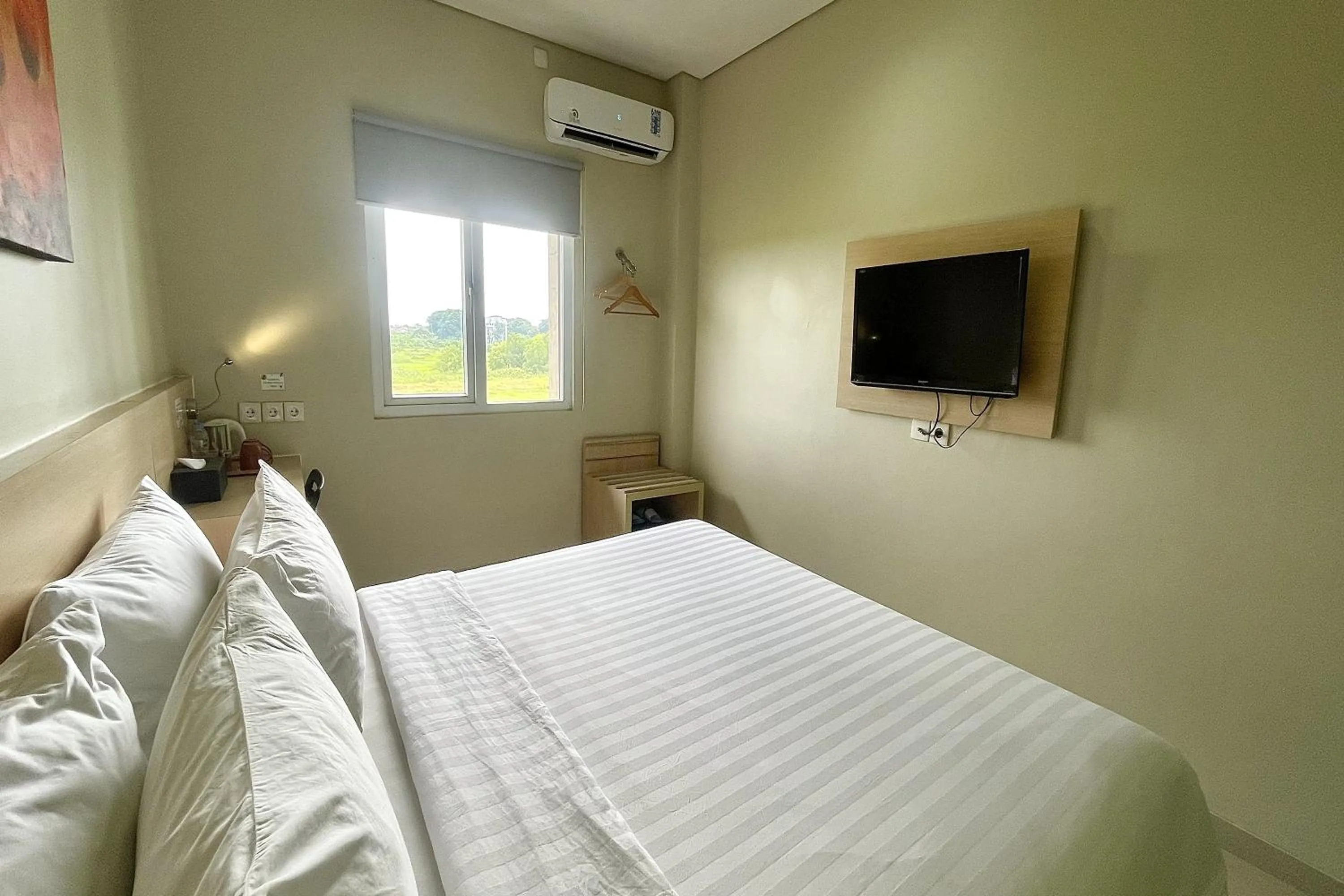 Bed in Lemo Hotel Serpong