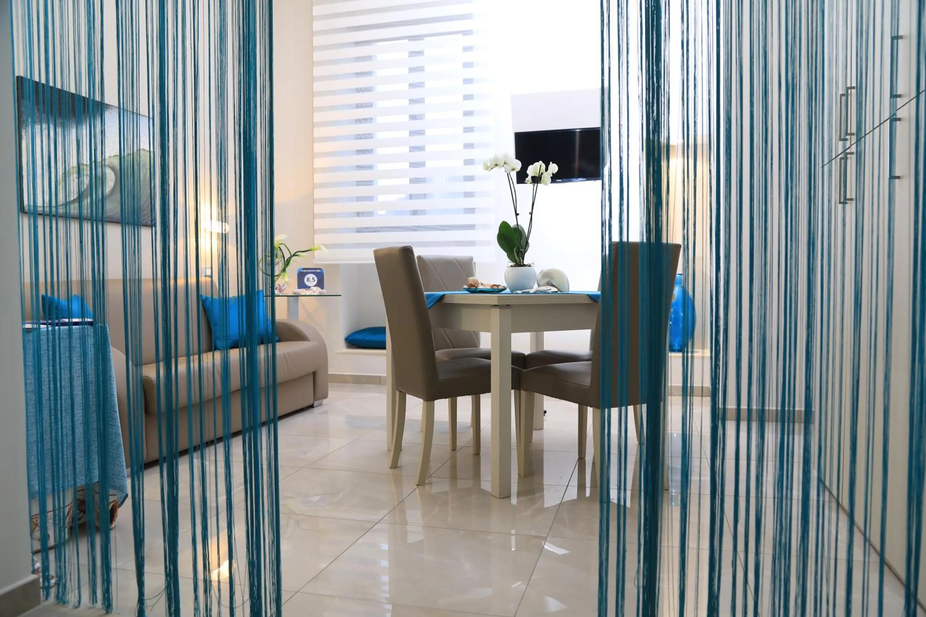 Communal lounge/ TV room in Acquamarina B&b