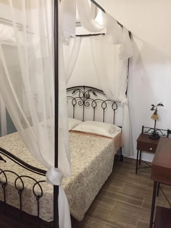 Bed in Anastasia Studios, Apartments & Suites
