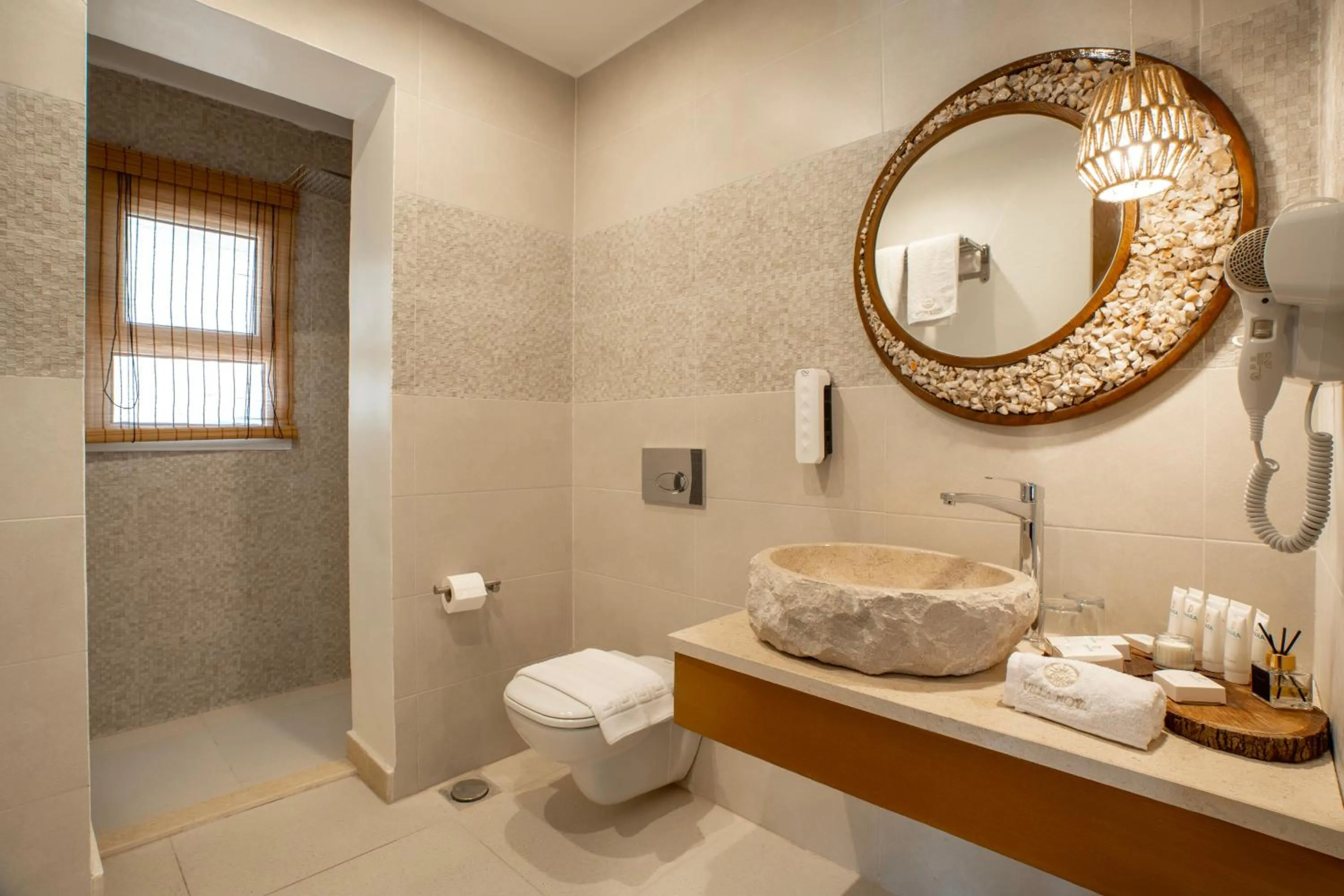 Bathroom in Noya By Dhara Hotels
