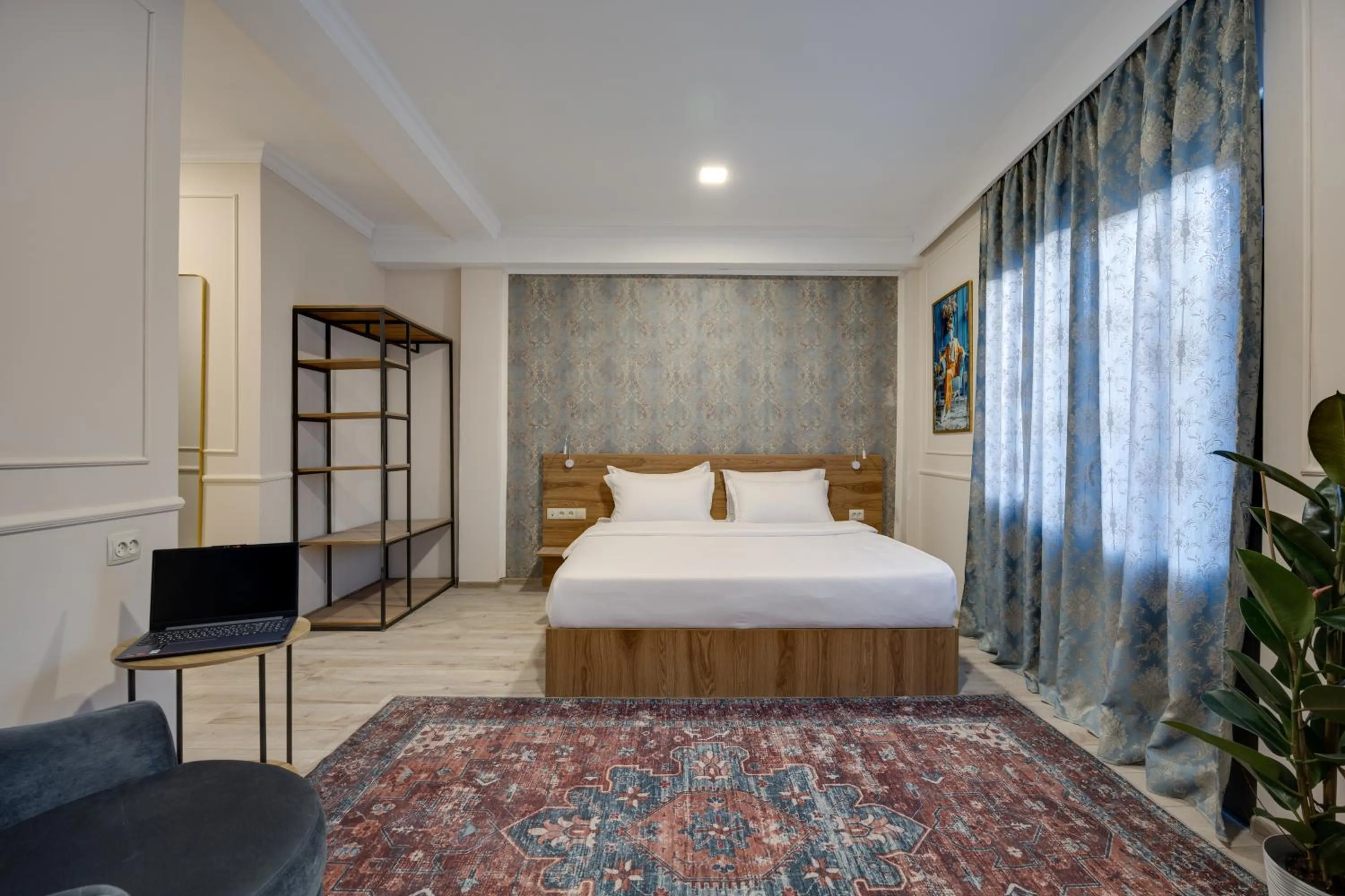 Photo of the whole room, Bed in Regraph Hotel