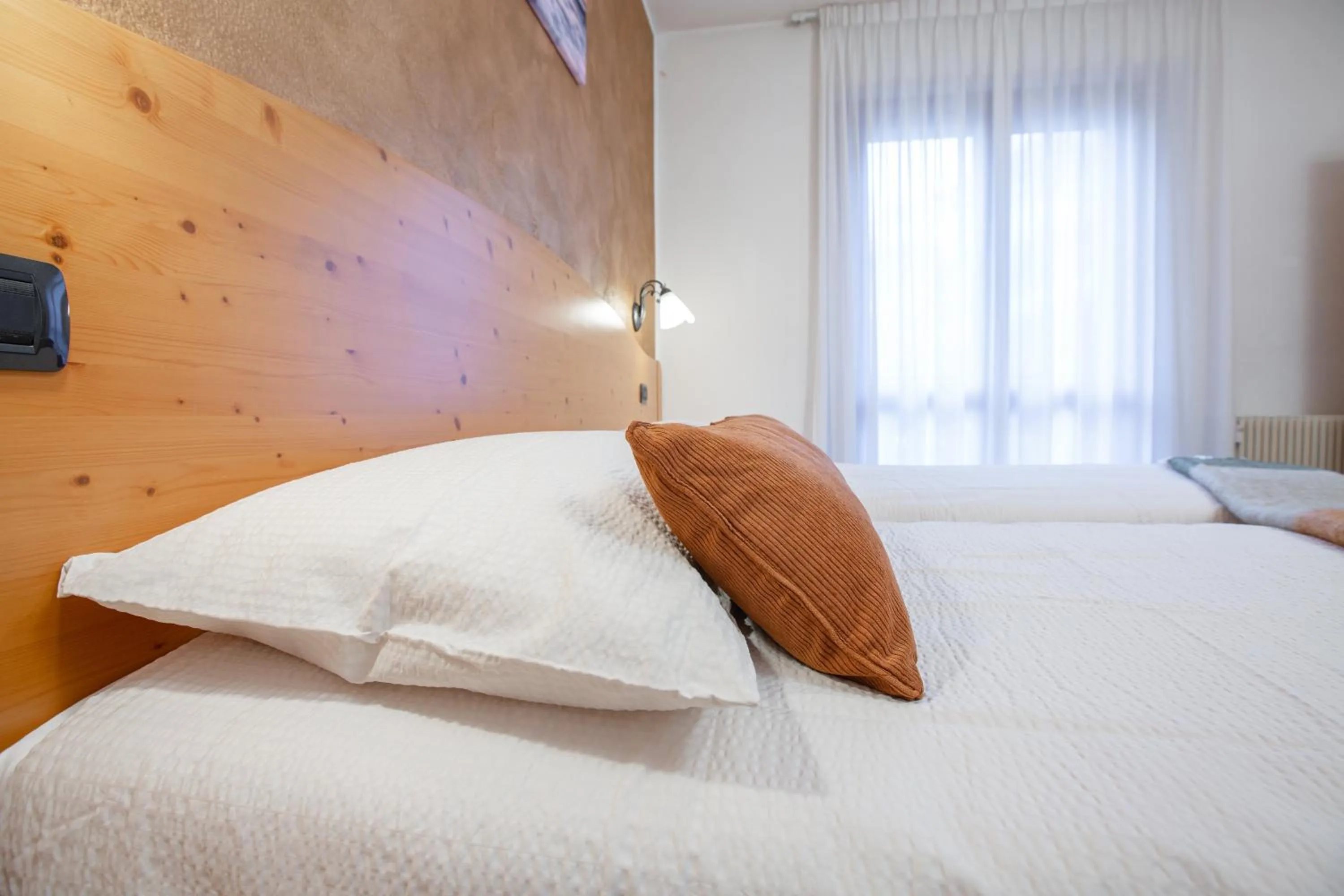 Bed in Hotel Biancospino