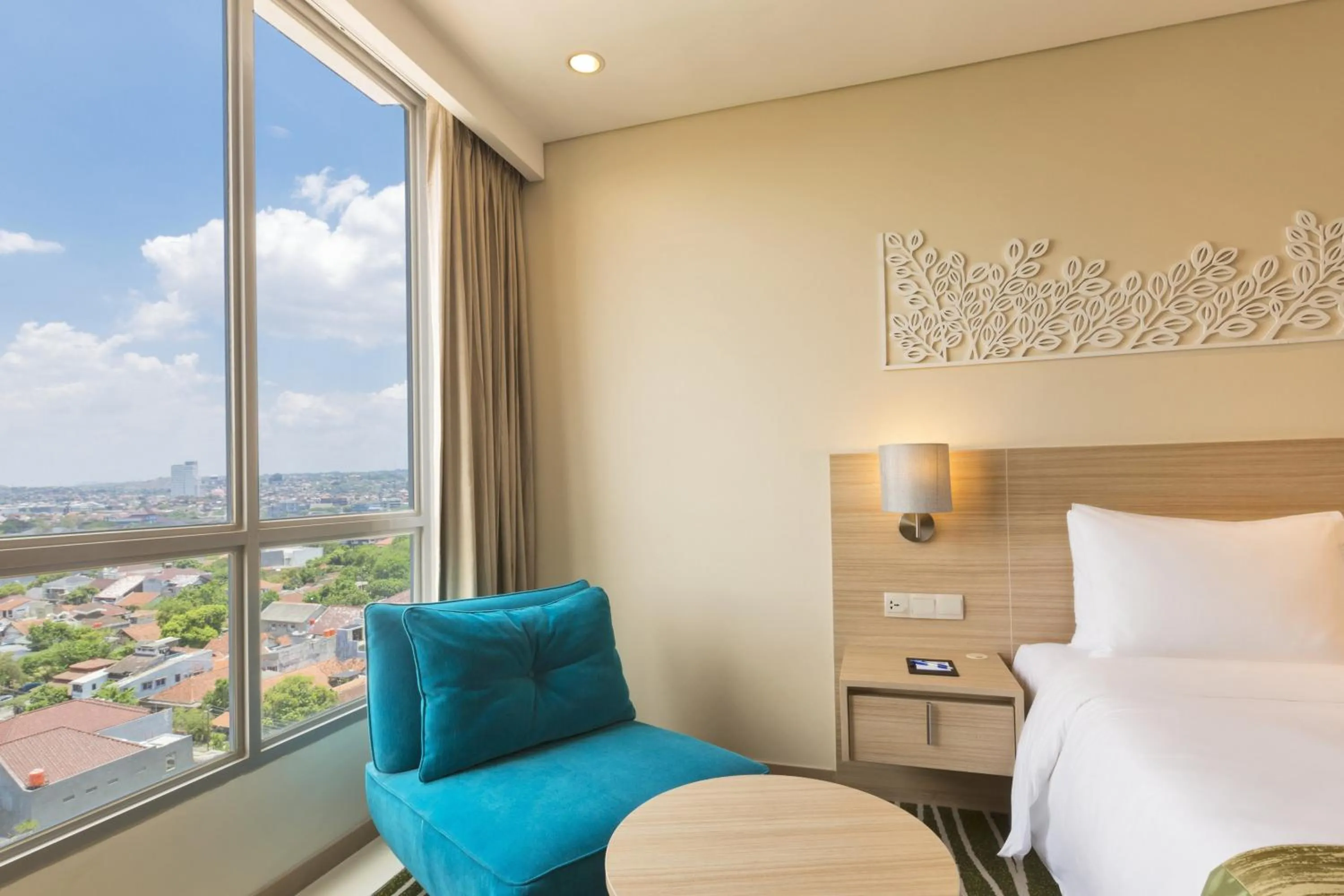 Seating area, Bed in Holiday Inn Express Semarang Simpang Lima by IHG