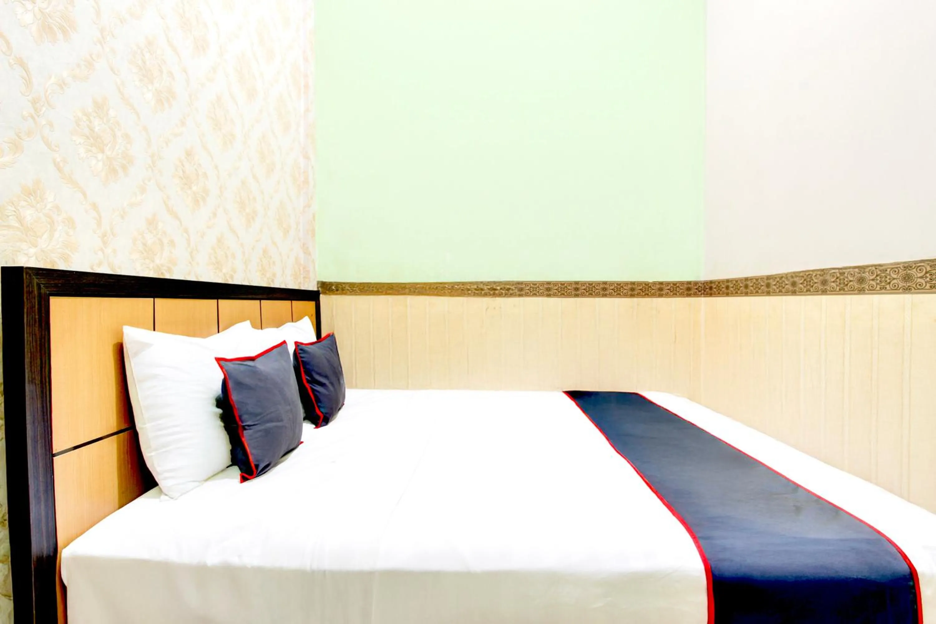 Bed in Hotel O Mega Inn Guest House