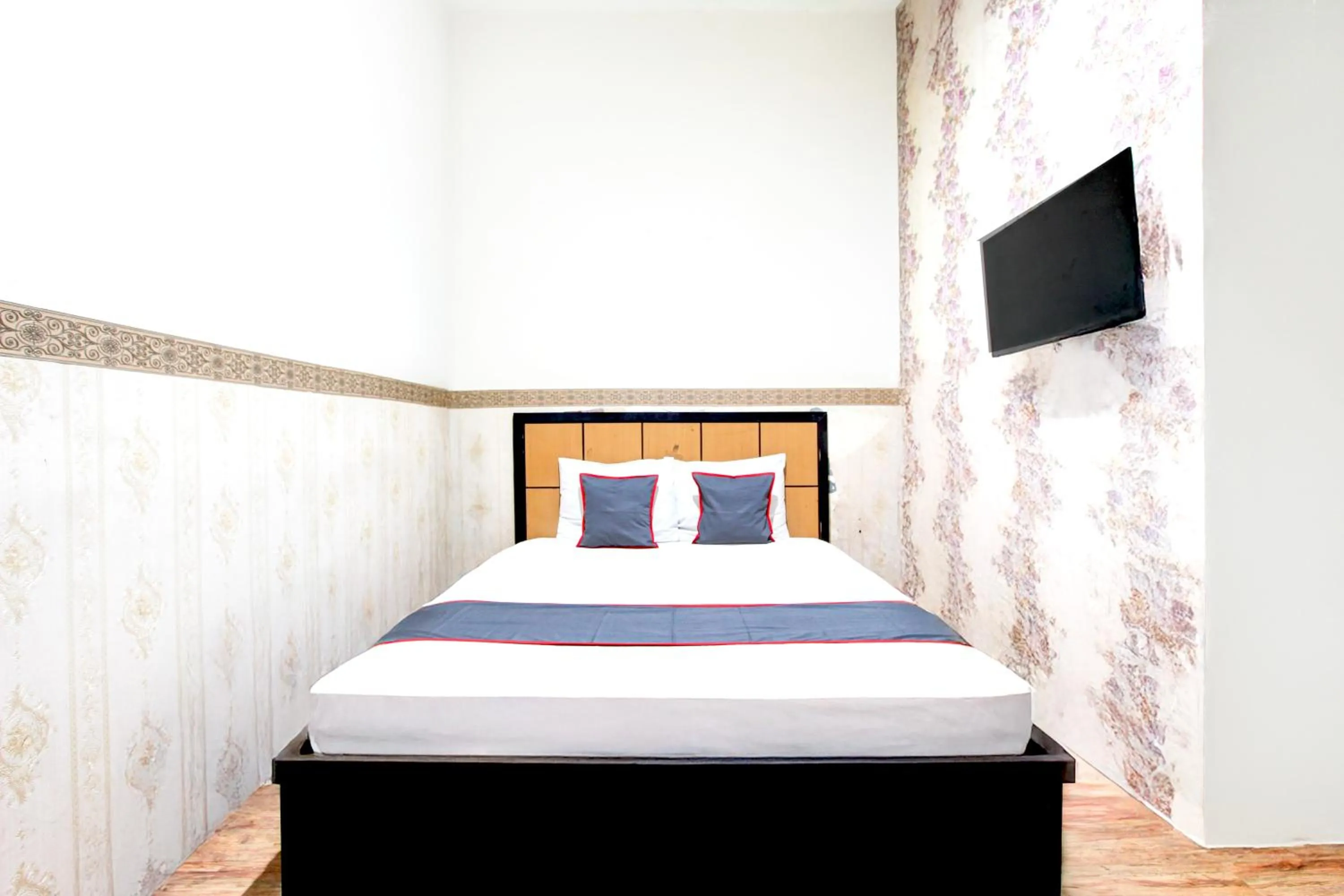 Bed in Hotel O Mega Inn Guest House