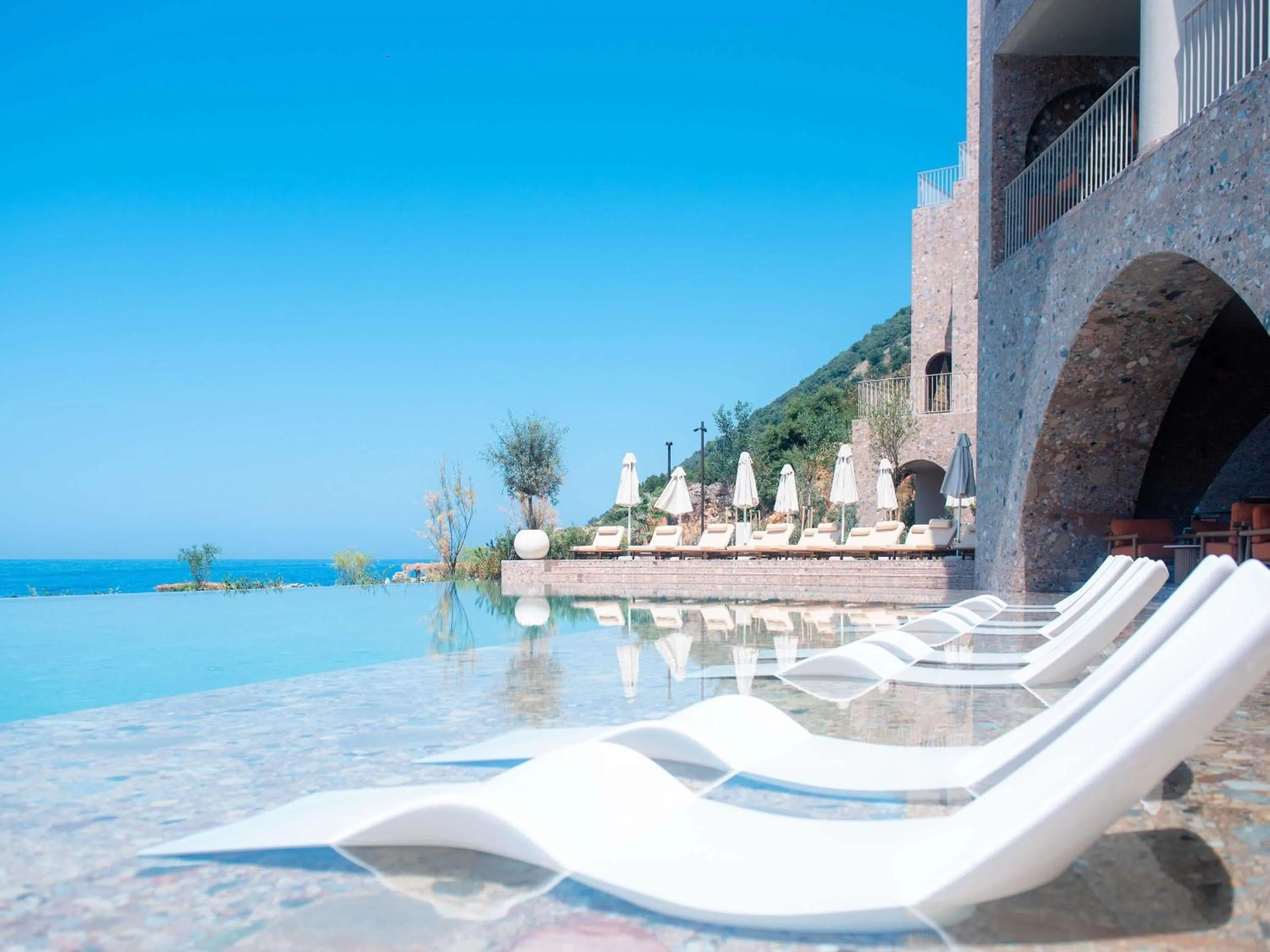 Pool view in Green Coast Hotel MGallery Collection