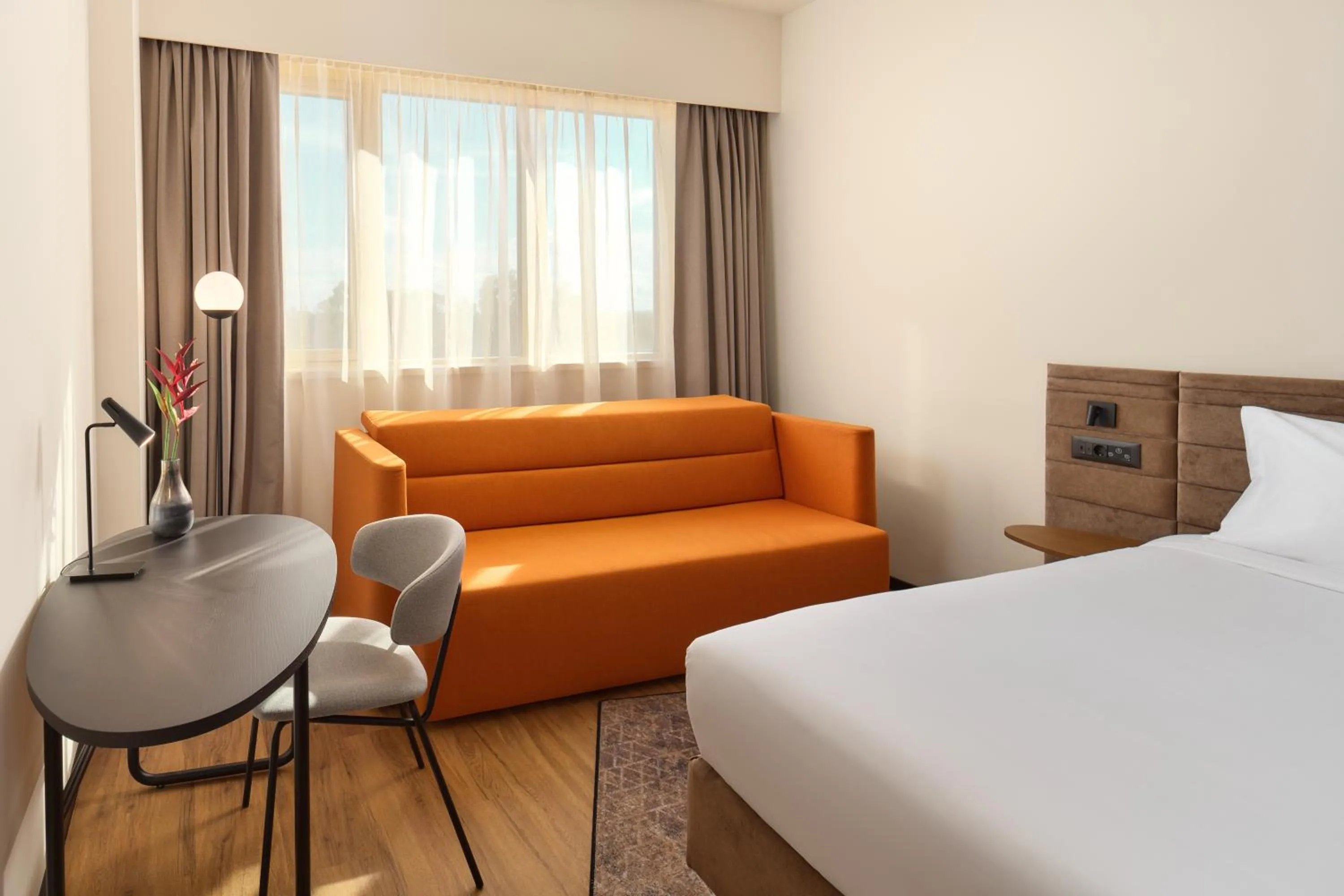 Seating area, Bed in Novotel Zagreb