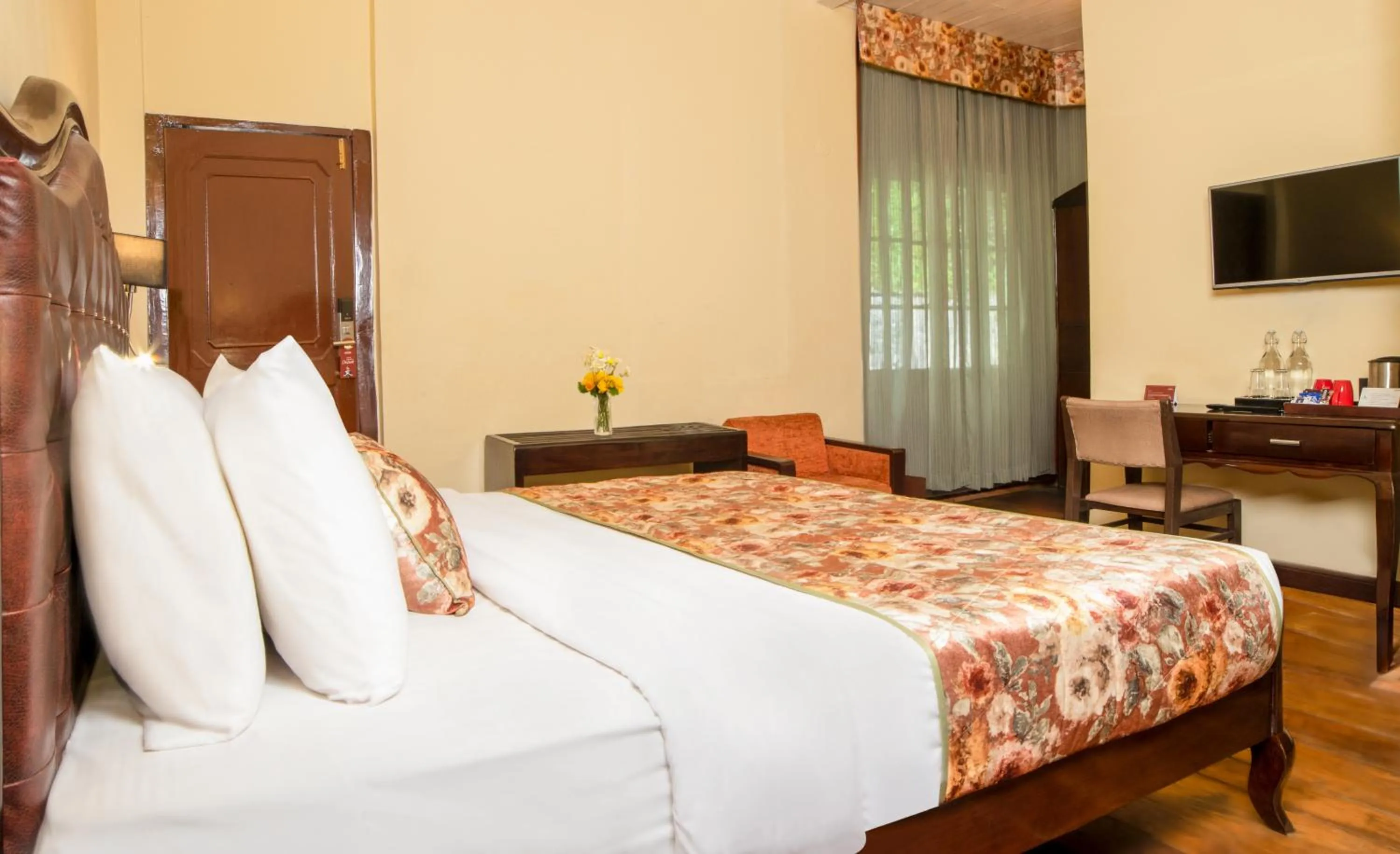 Bed in Summit Swiss Heritage Resort & Spa