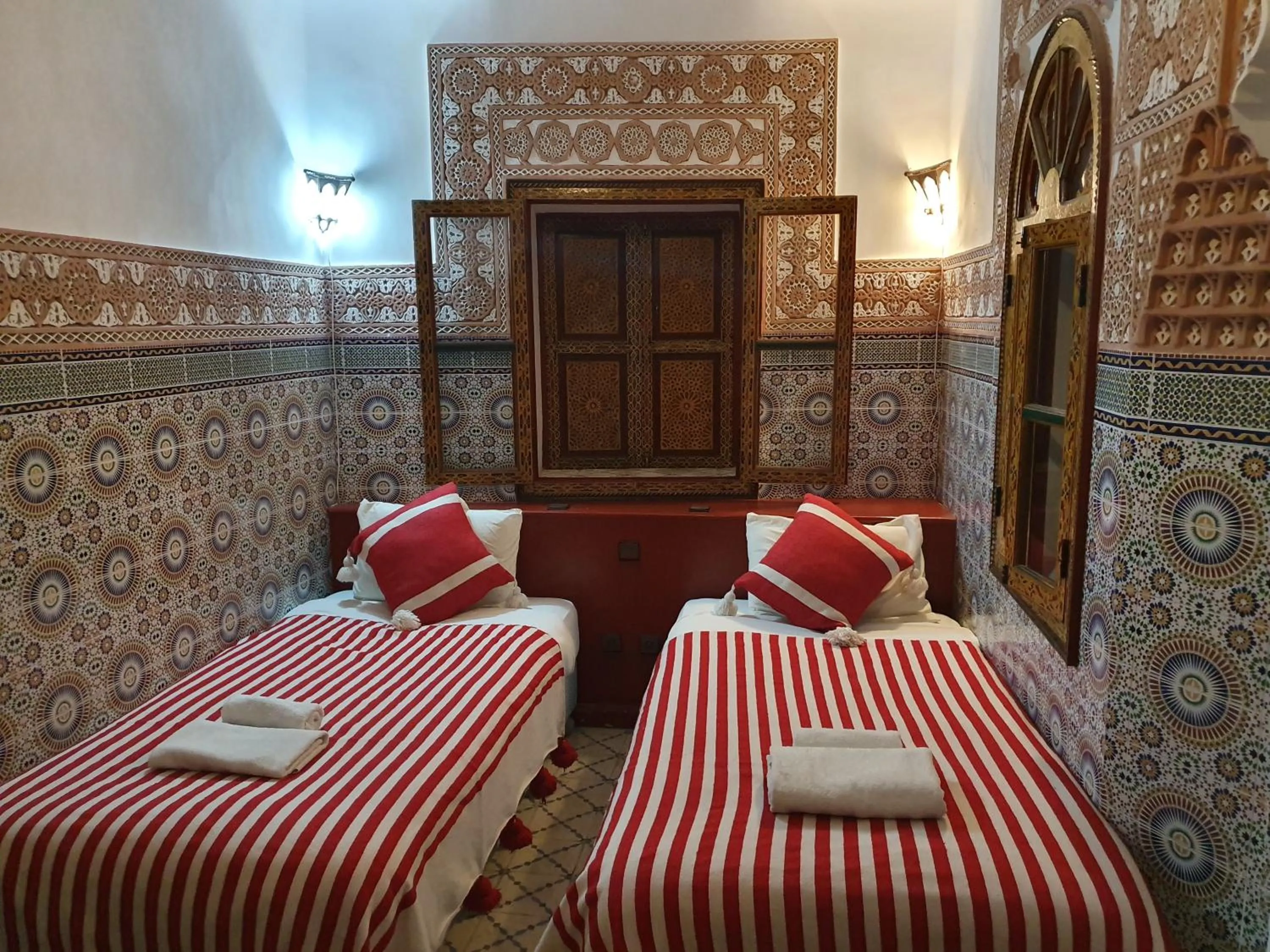 Bed in Riad Alma Mouassine