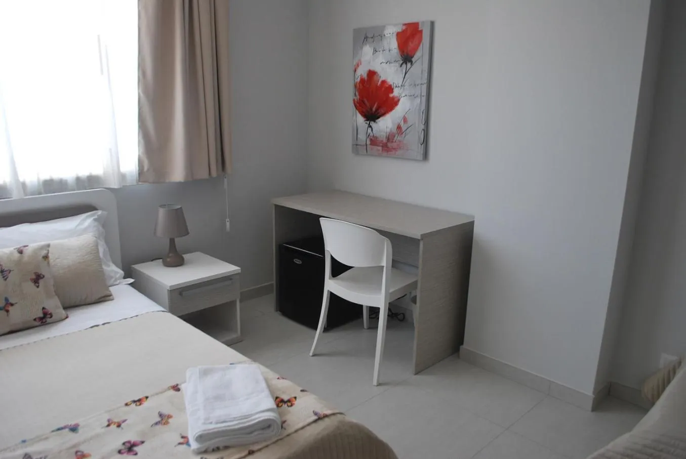 Bed in Pietra Bianca Rooms