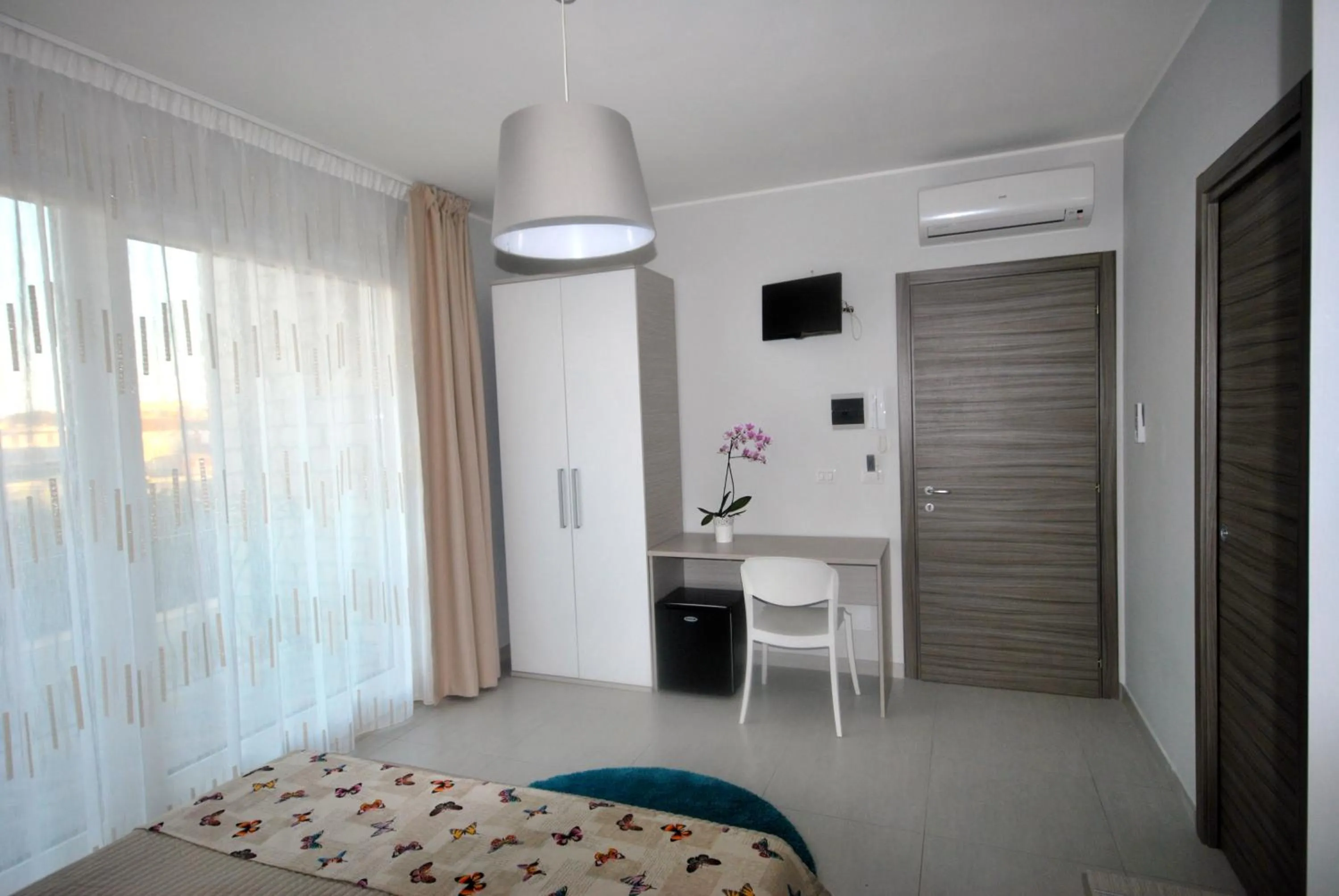 Bed in Pietra Bianca Rooms