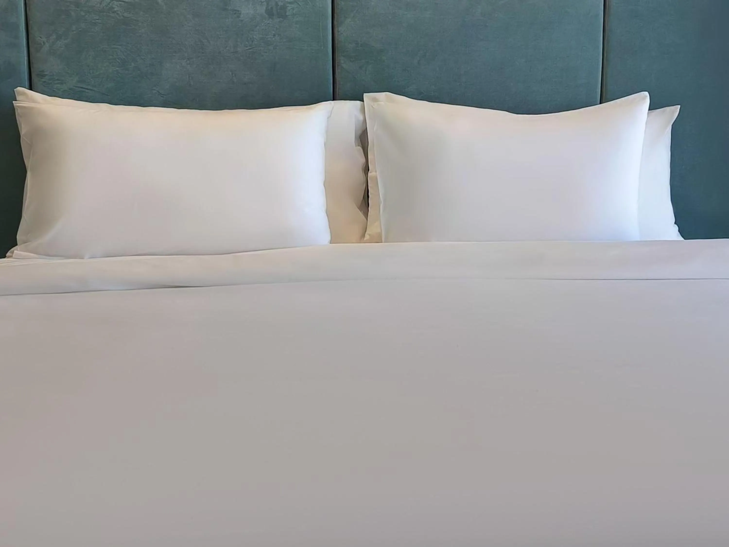 Bed in Laya Suites and Residences