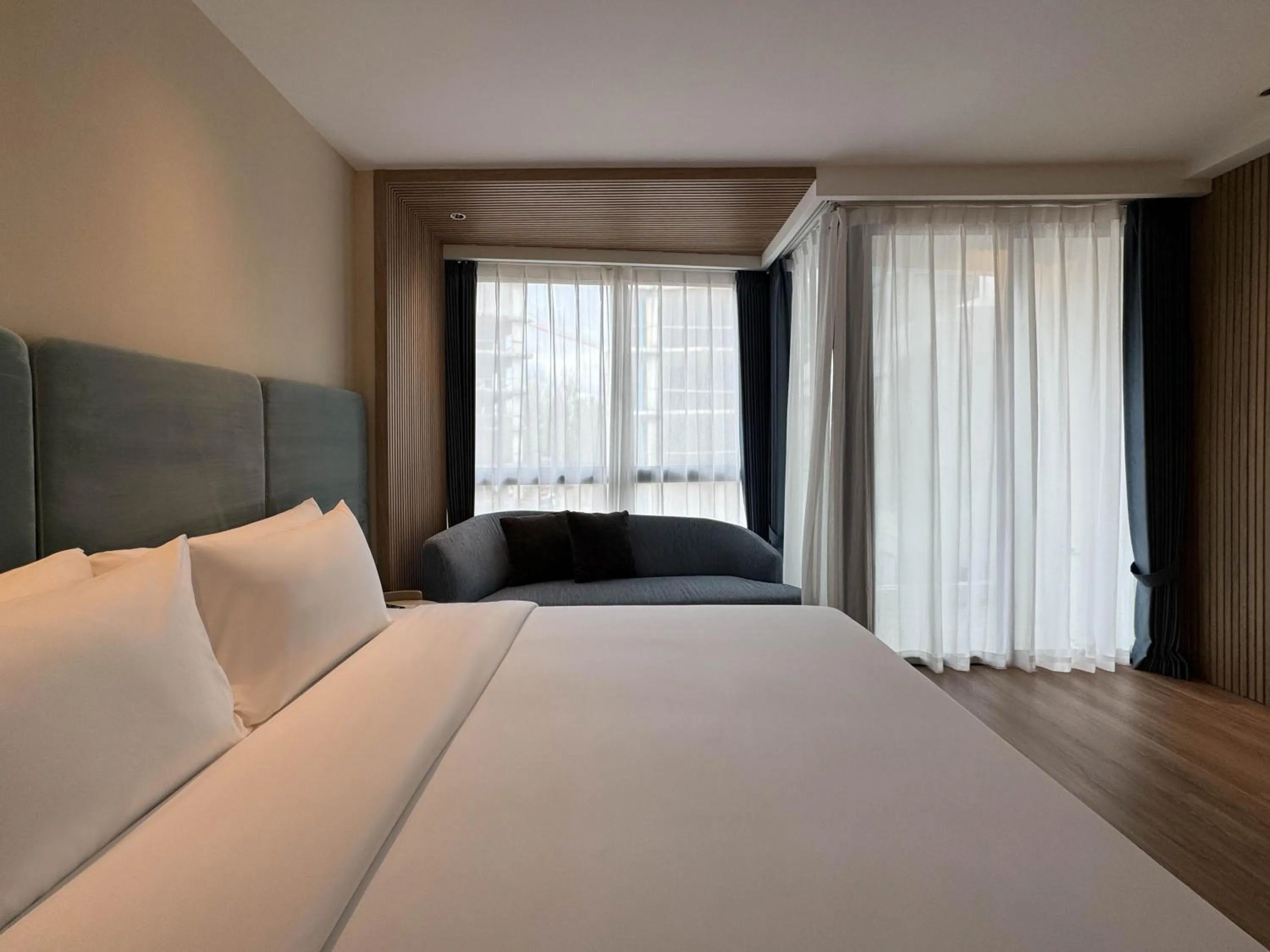 Bed in Laya Suites and Residences