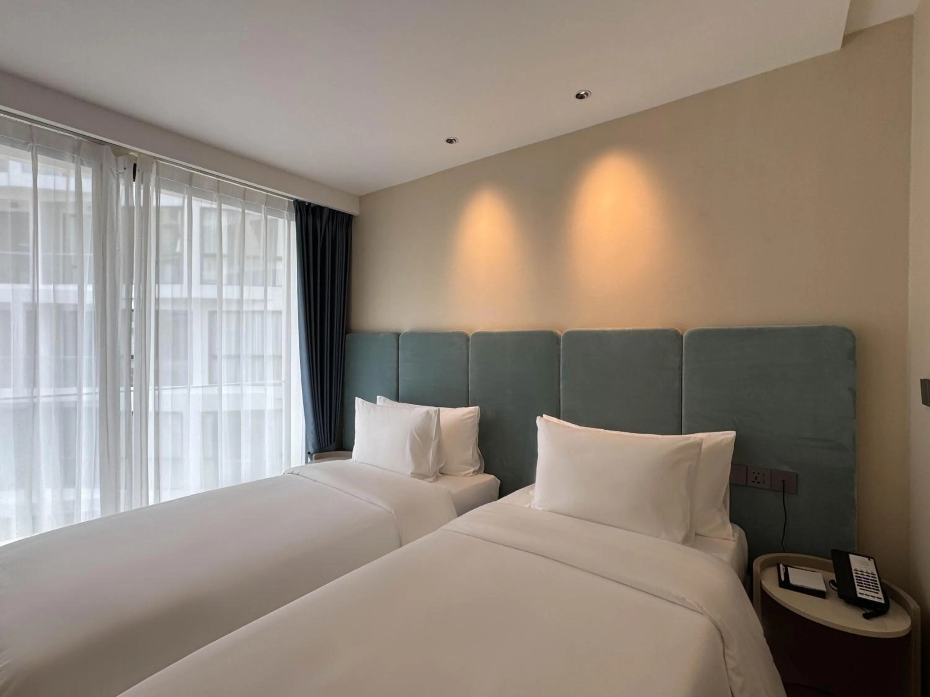 Bed in Laya Suites and Residences