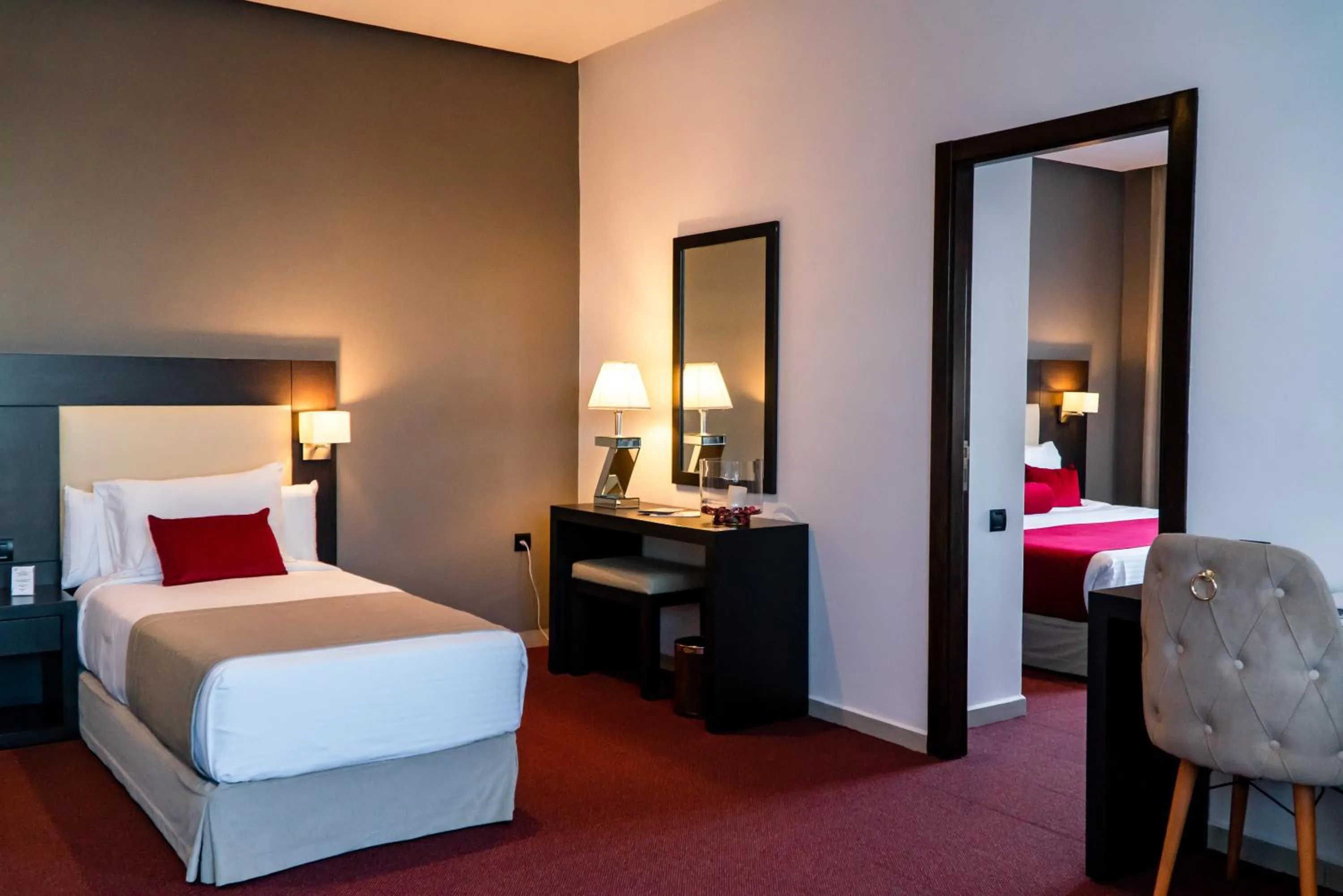 Communal lounge/ TV room, Bed in Hôtel Tamuda Beach