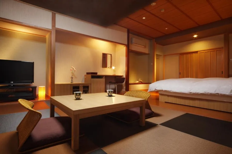 Bed in Hotel Kunitomi Suisennkaku