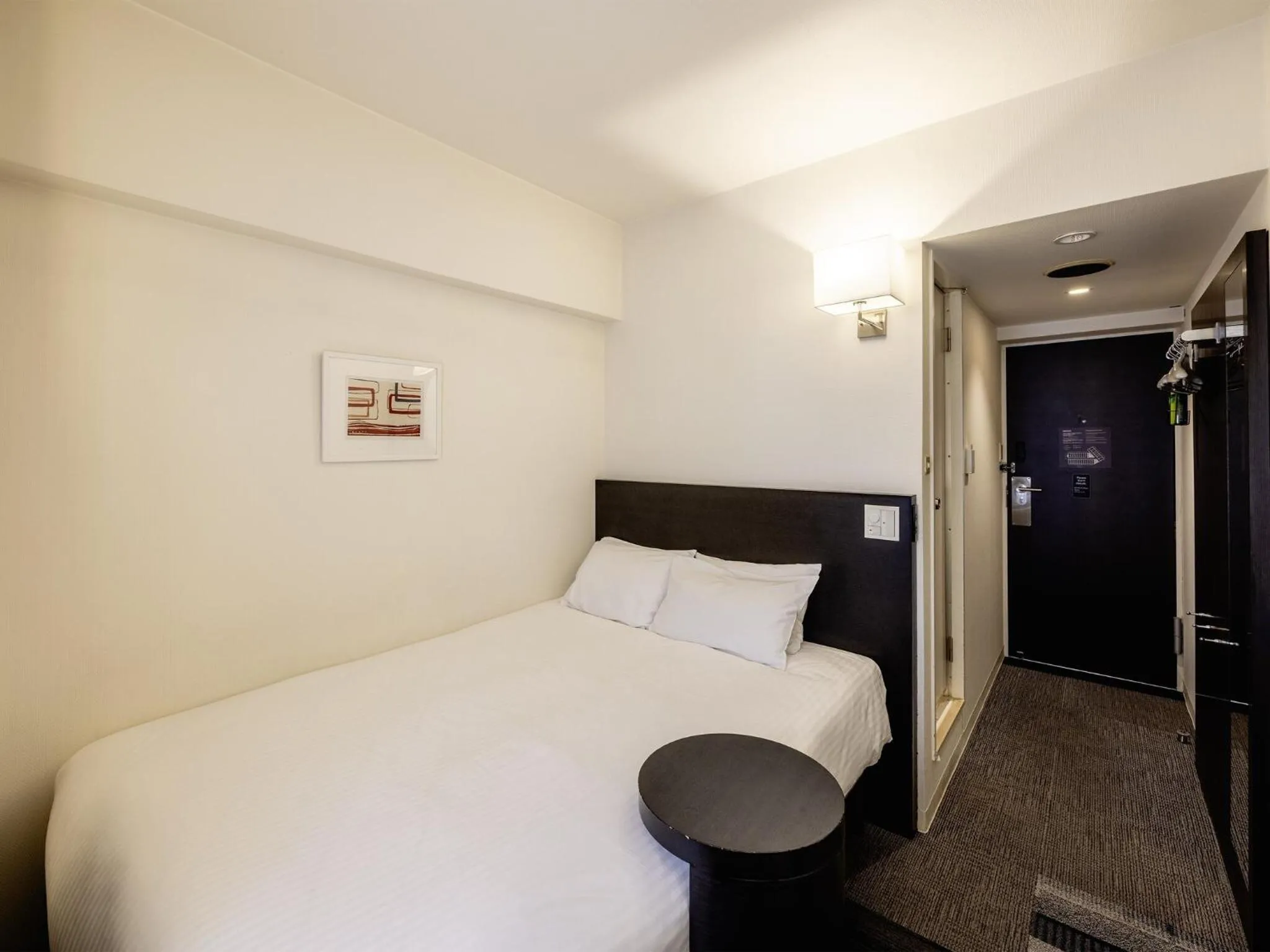 Bed in KOKO HOTEL Yokohama Tsurumi