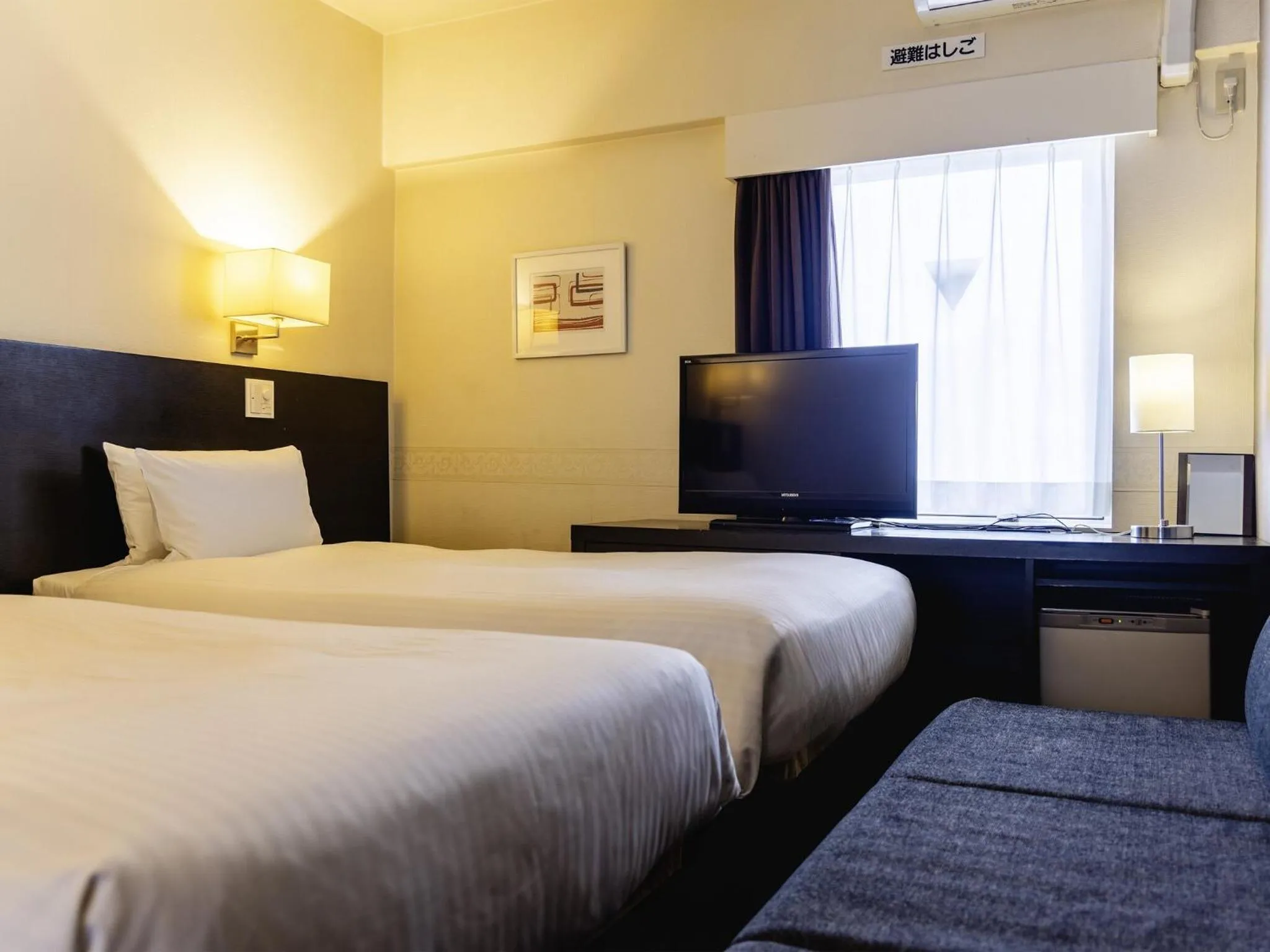 Photo of the whole room, Bed in KOKO HOTEL Yokohama Tsurumi