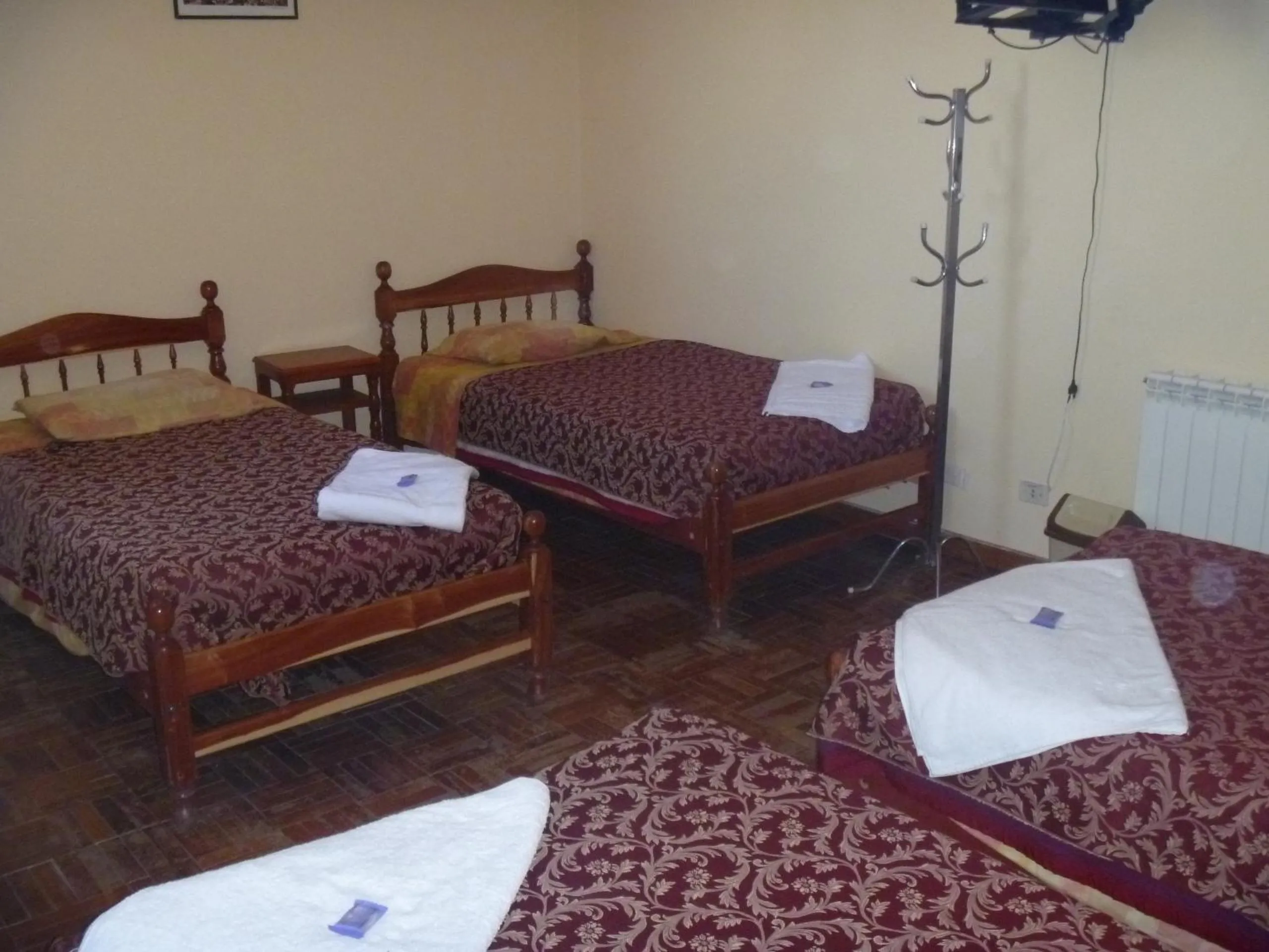 Bed in Julia Plaza Hotel
