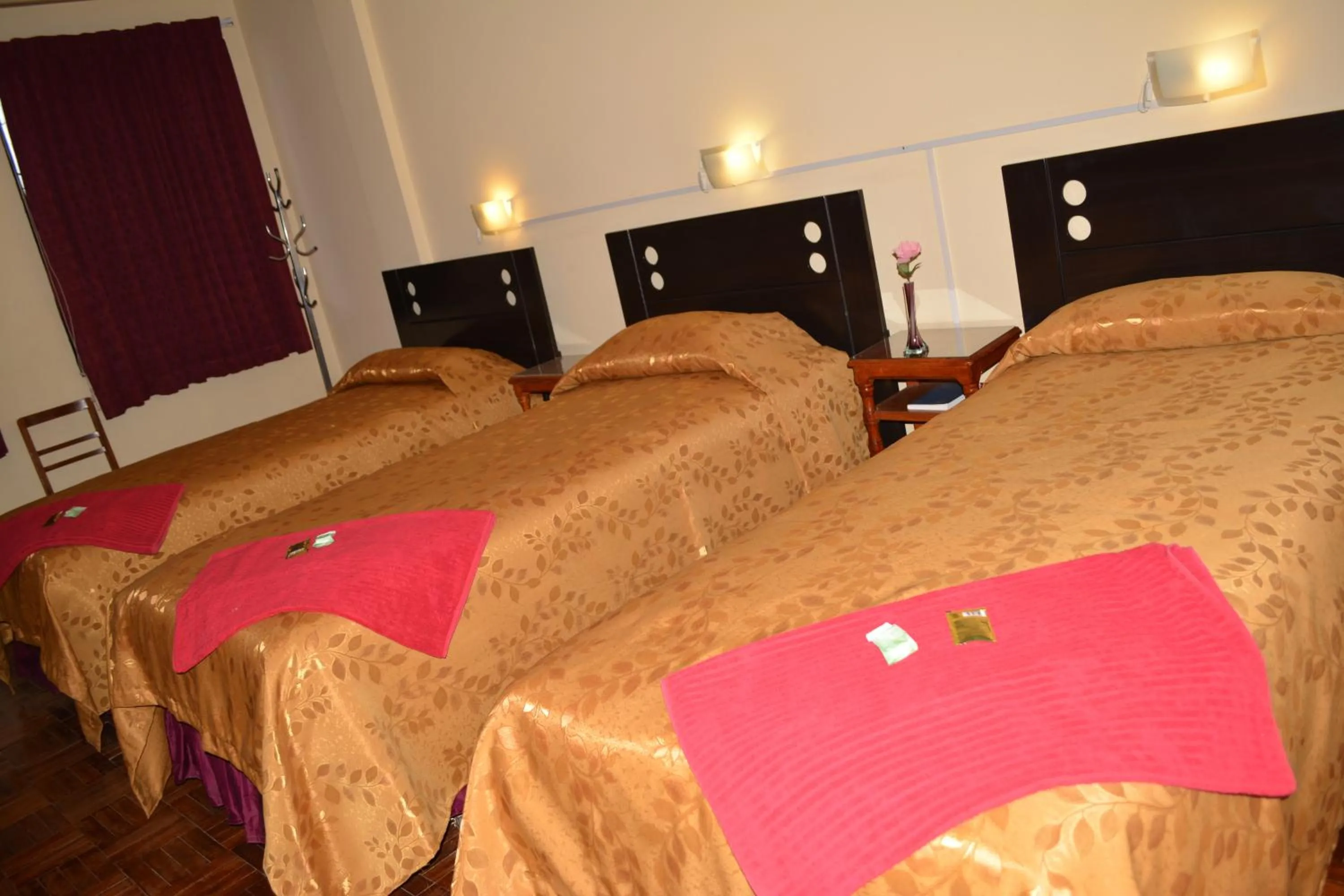 Bed in Julia Plaza Hotel