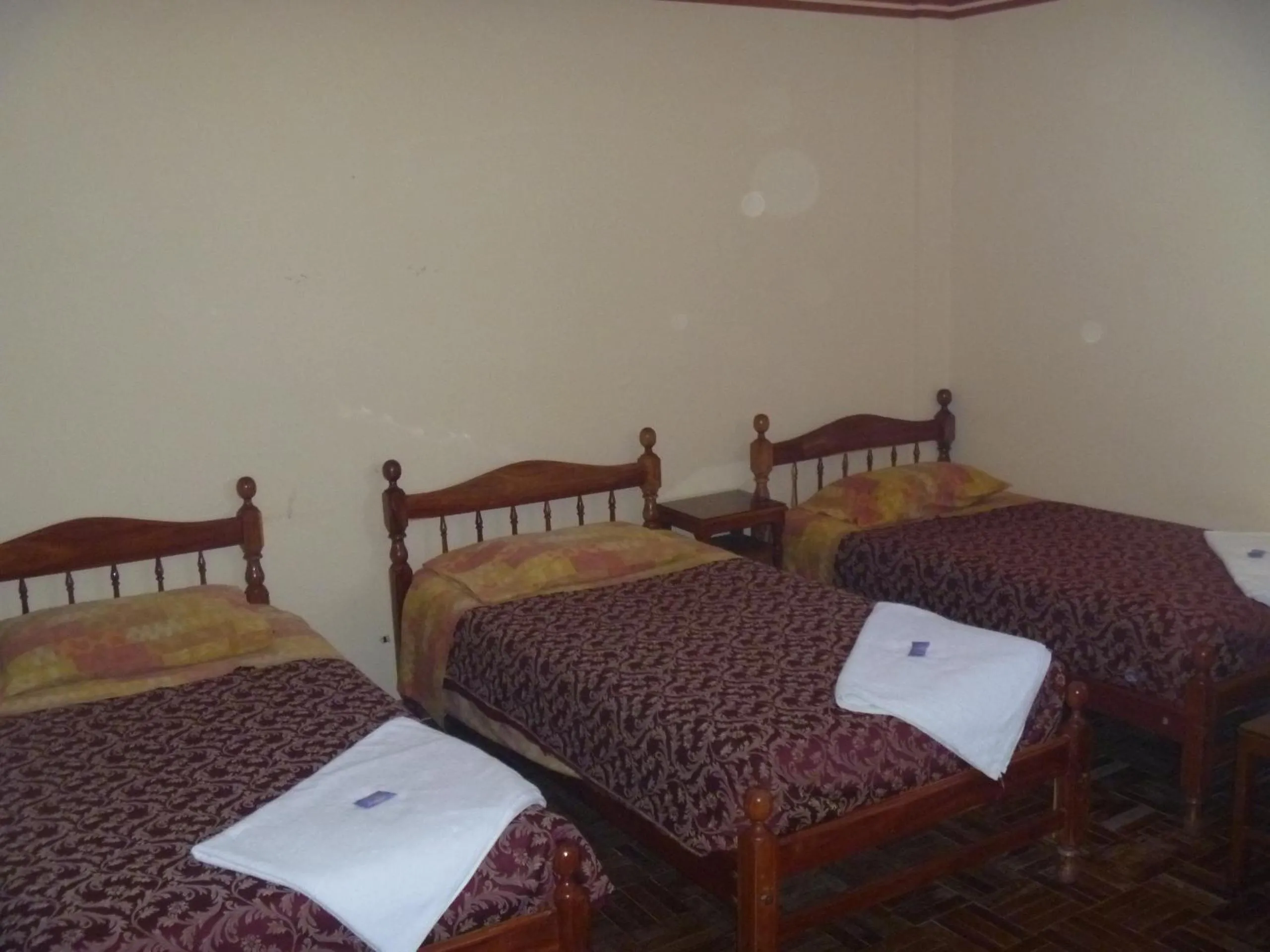 Bed in Julia Plaza Hotel