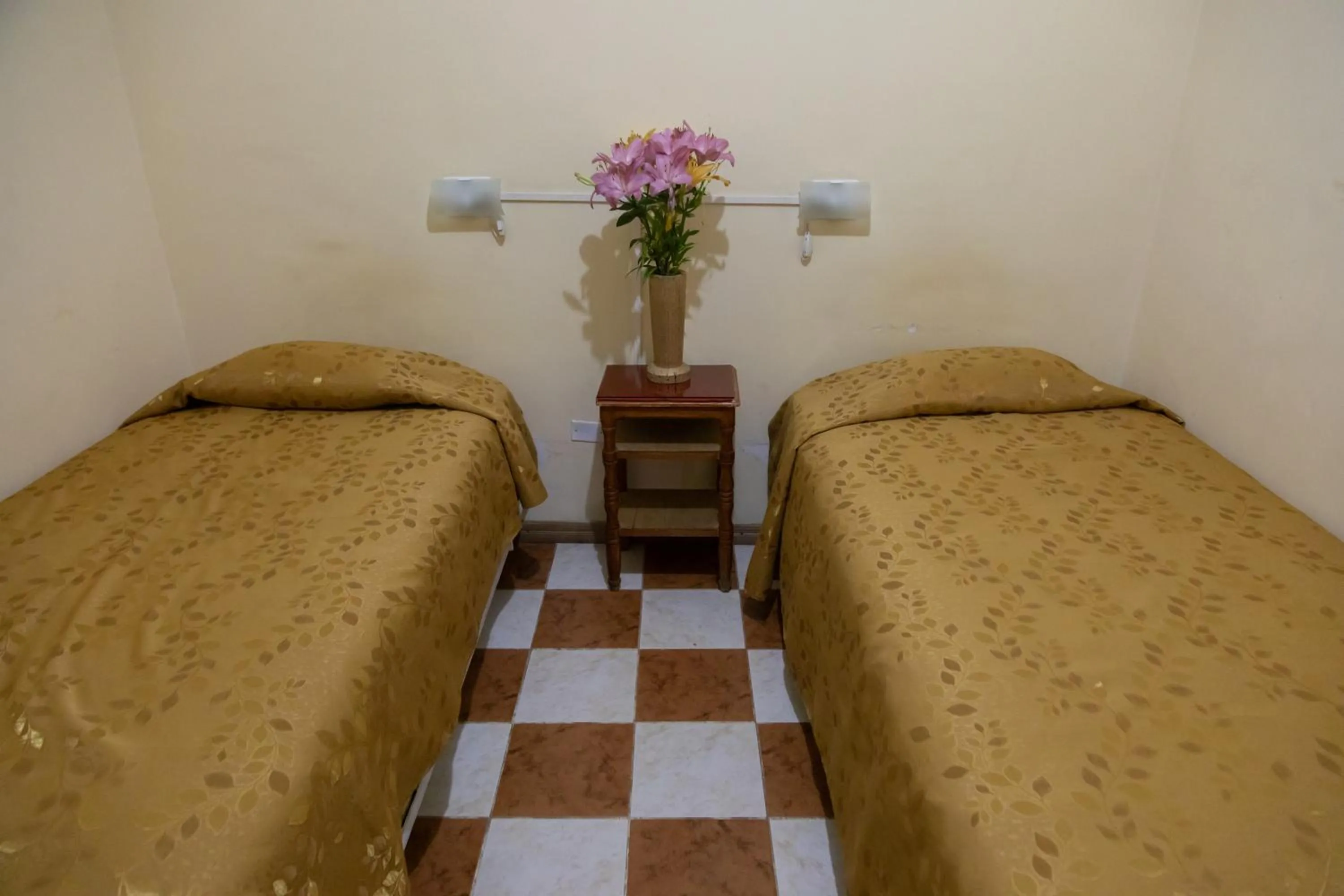 Bed in Julia Plaza Hotel